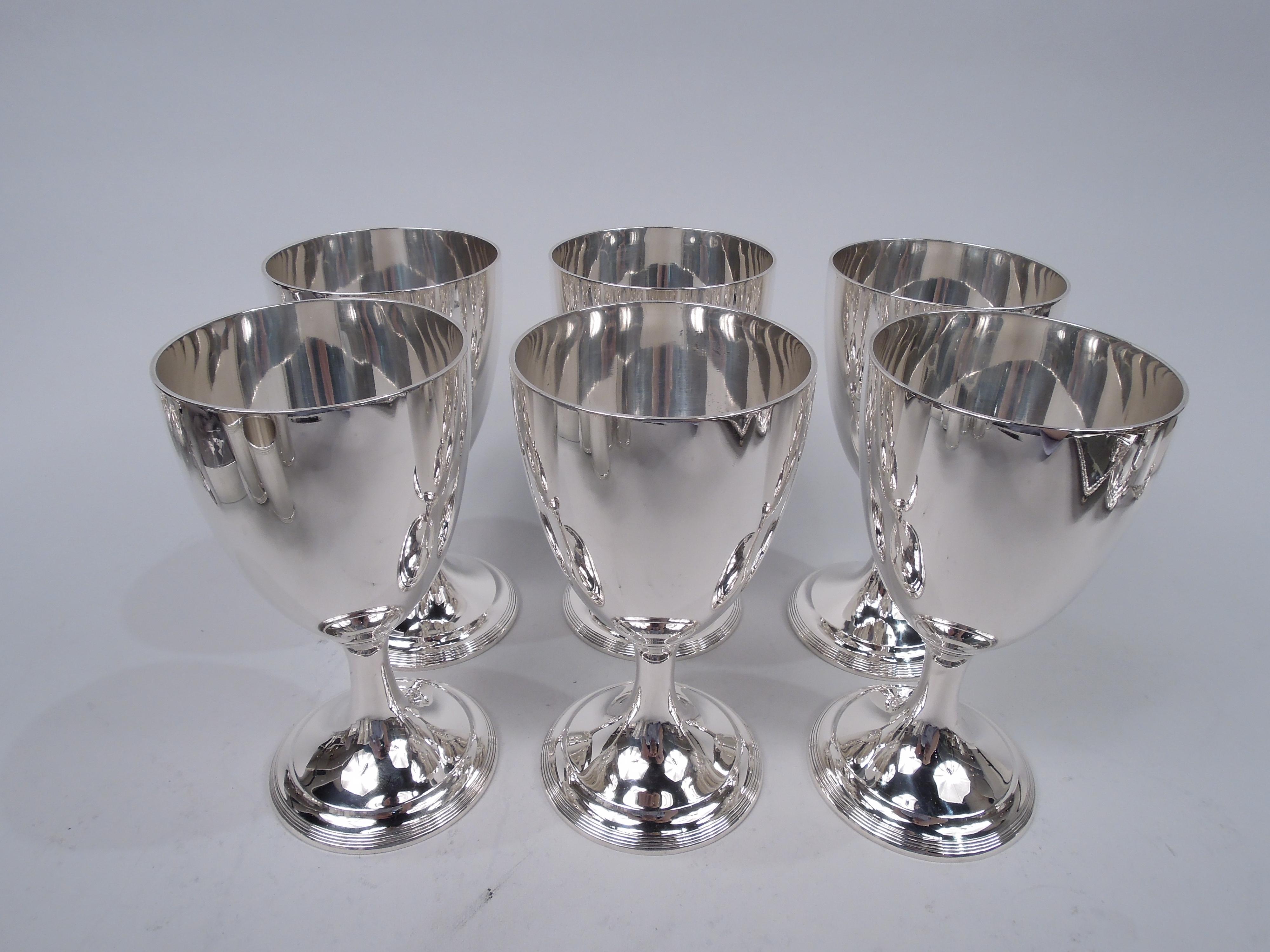 Set of 6 traditional Georgian Neoclassical sterling silver goblets. Made by Tiffany & Co. in New York, ca 1913. Each: Ovoid bowl on upward tapering stem flowing into domed and reeded foot. Fully marked including maker’s stamp, pattern no. 18548