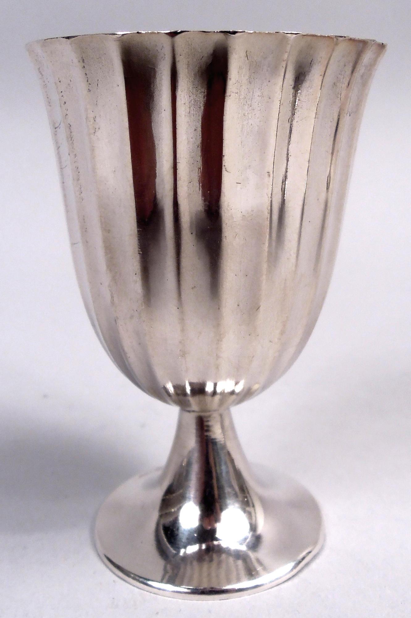 Set of 6 Midcentury Classical sterling silver cordial cups. Each: Fluted and flared bowl with gilt interior; raised foot. Marked “Tiffany & Co / Makers / Sterling”. Total weight: 7 troy ounces. 