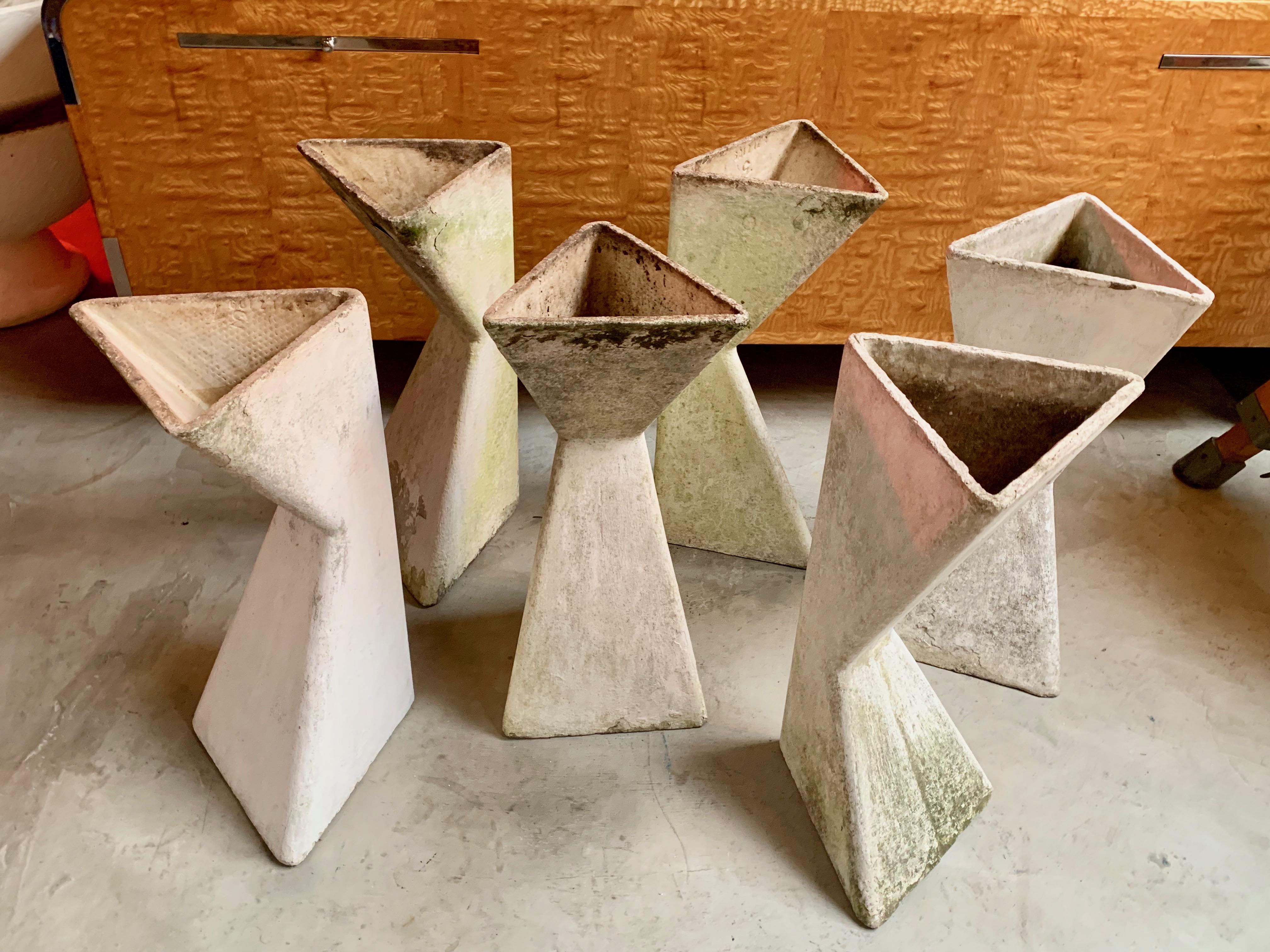 Extremely rare concrete planters by Willy Guhl. Triangular shape and able to be planted right side up, or upside down. Drainage holes inside. They look great spread out as a sculptural installation or grouped together as a circular unit. 6