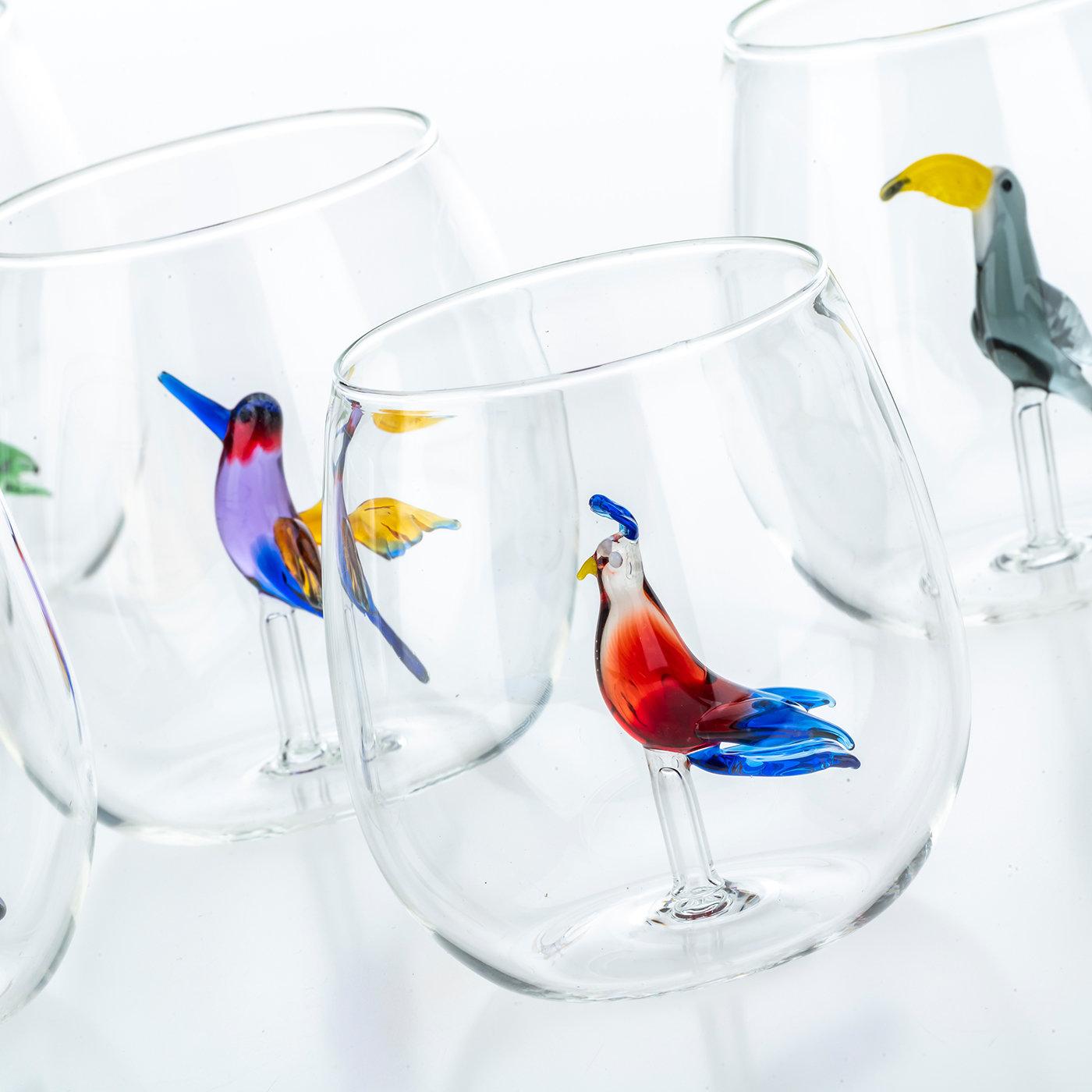 Refined and charming, this set is part of a new Casarialto collection inspired by the bright colors of tropical islands. Handmade of blown glass by skilled Venetian artisans, the set features a colorful tropical bird, dainty details, and a colorful