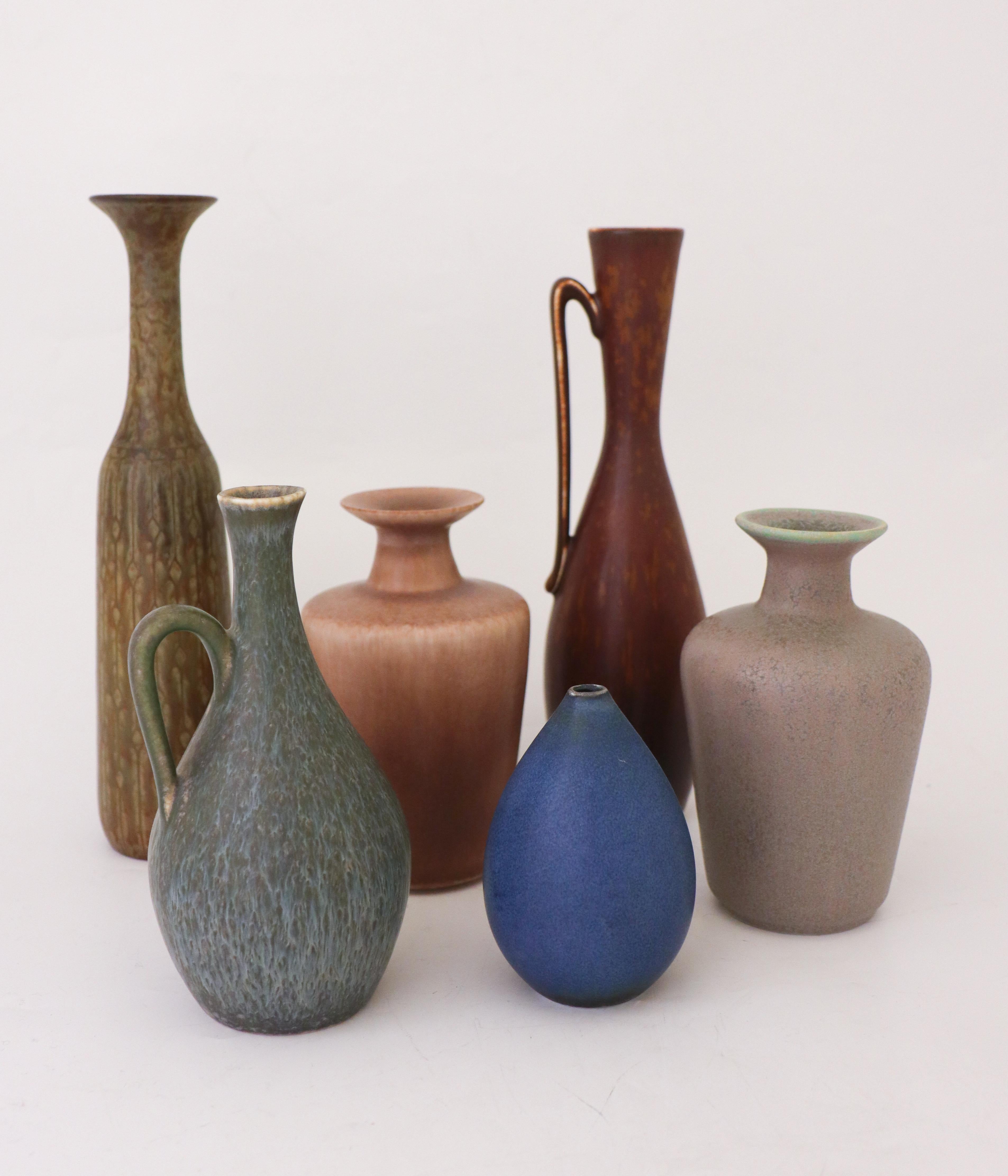 A group of six vases designed by Gunnar Nylund and Carl-Harry Stålhane at Rörstrand, the pieces are between 25.5 - 9.5 cm high. The set contains 4 vases by Gunnar Nylund and two vases by Carl-Harry Stålhane. Four vases are first quality and two of