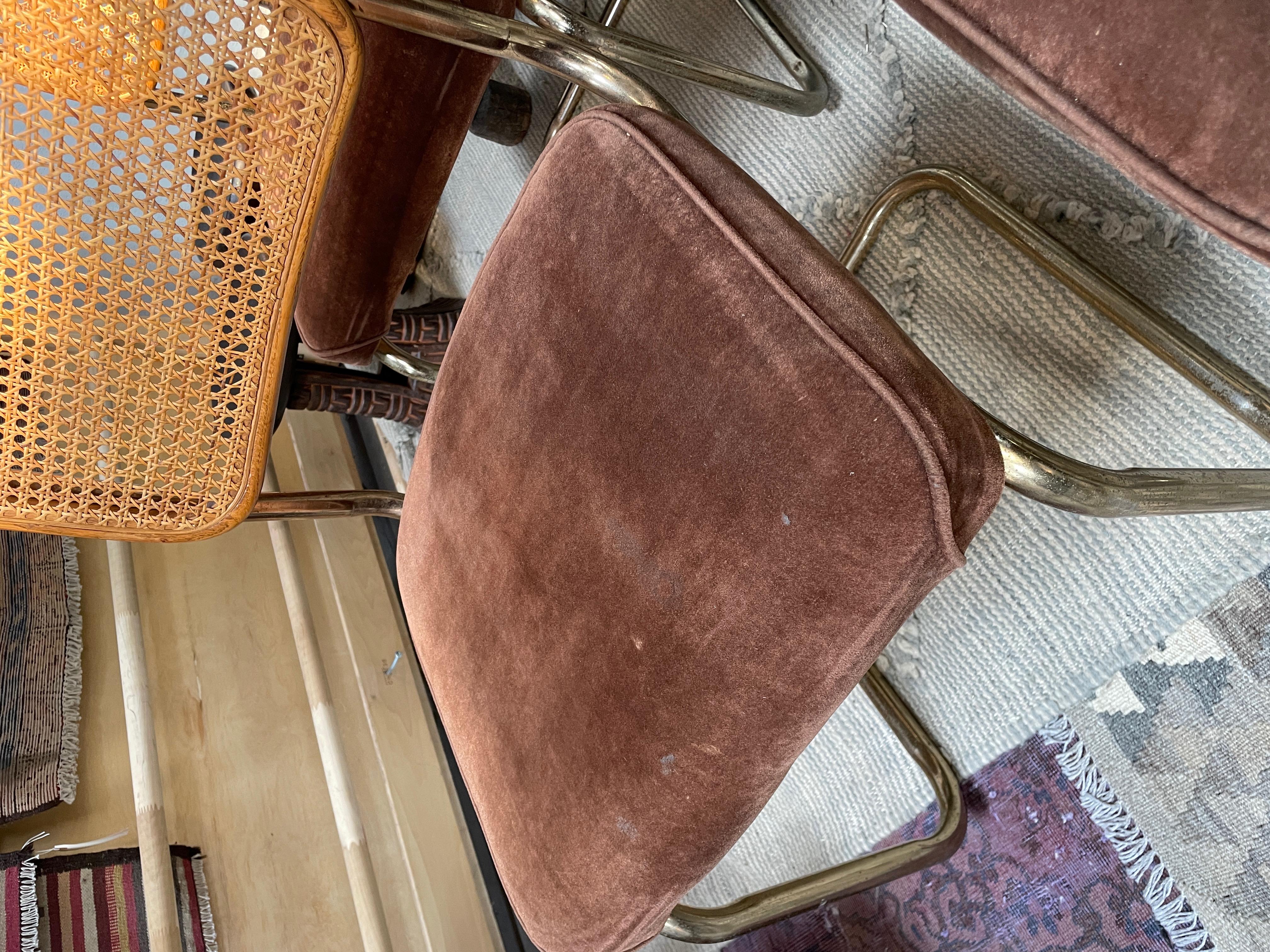 Cesca inspired dining chairs. These are vintage with cane backs and metal frames they have some staining to the velvet upholstery along with vintage wear. They go beautifully with virtually any table and a variety of design esthetics.