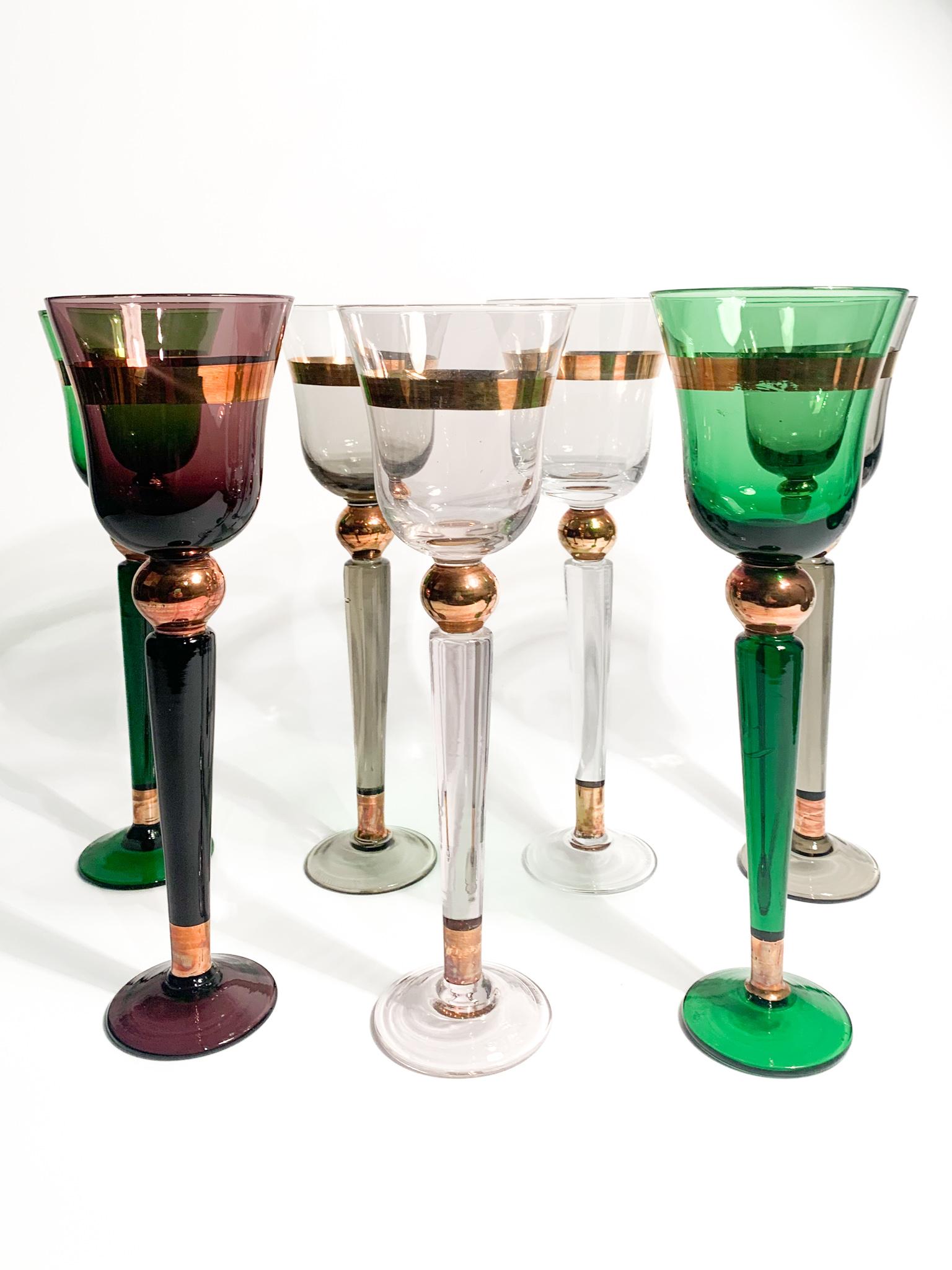 Set of six glasses (plus 1) in multicolored Murano glass, made by Venini in the 1950s. Each glass is signed at the base.

Ø 7 cm h 21.5 cm