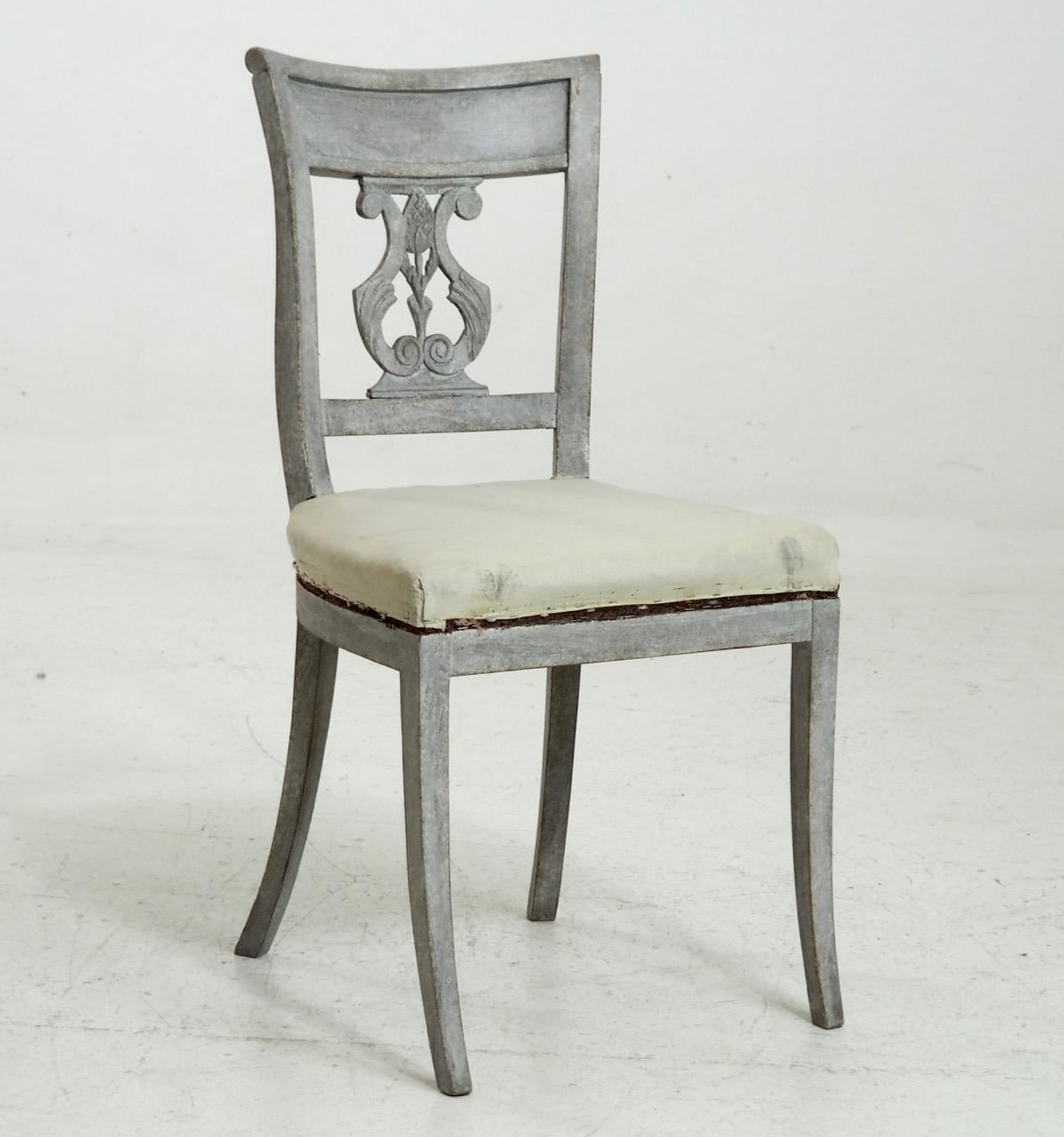 Set of 6 very rare dinning room chairs, from the northern Europe, with richly carved lyre back, circa 1820.