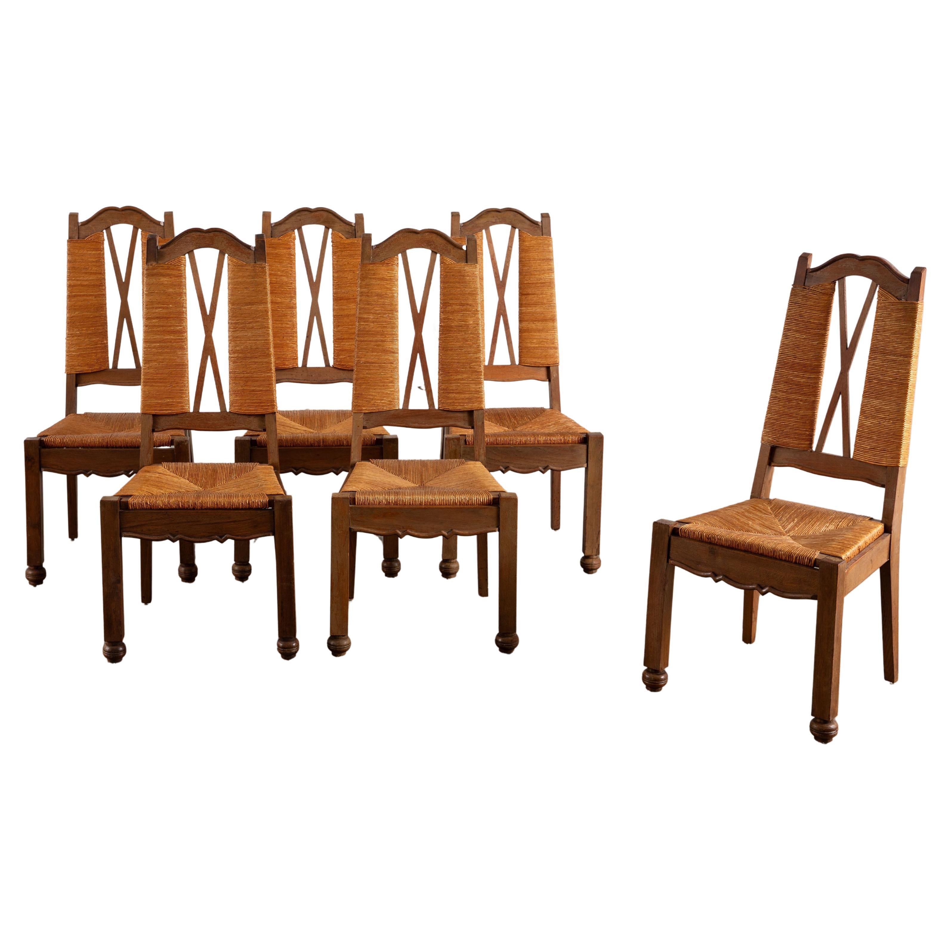 Ensemble de 6 chaises de salle à manger en chêne français des années 1940 avec sièges en cannage