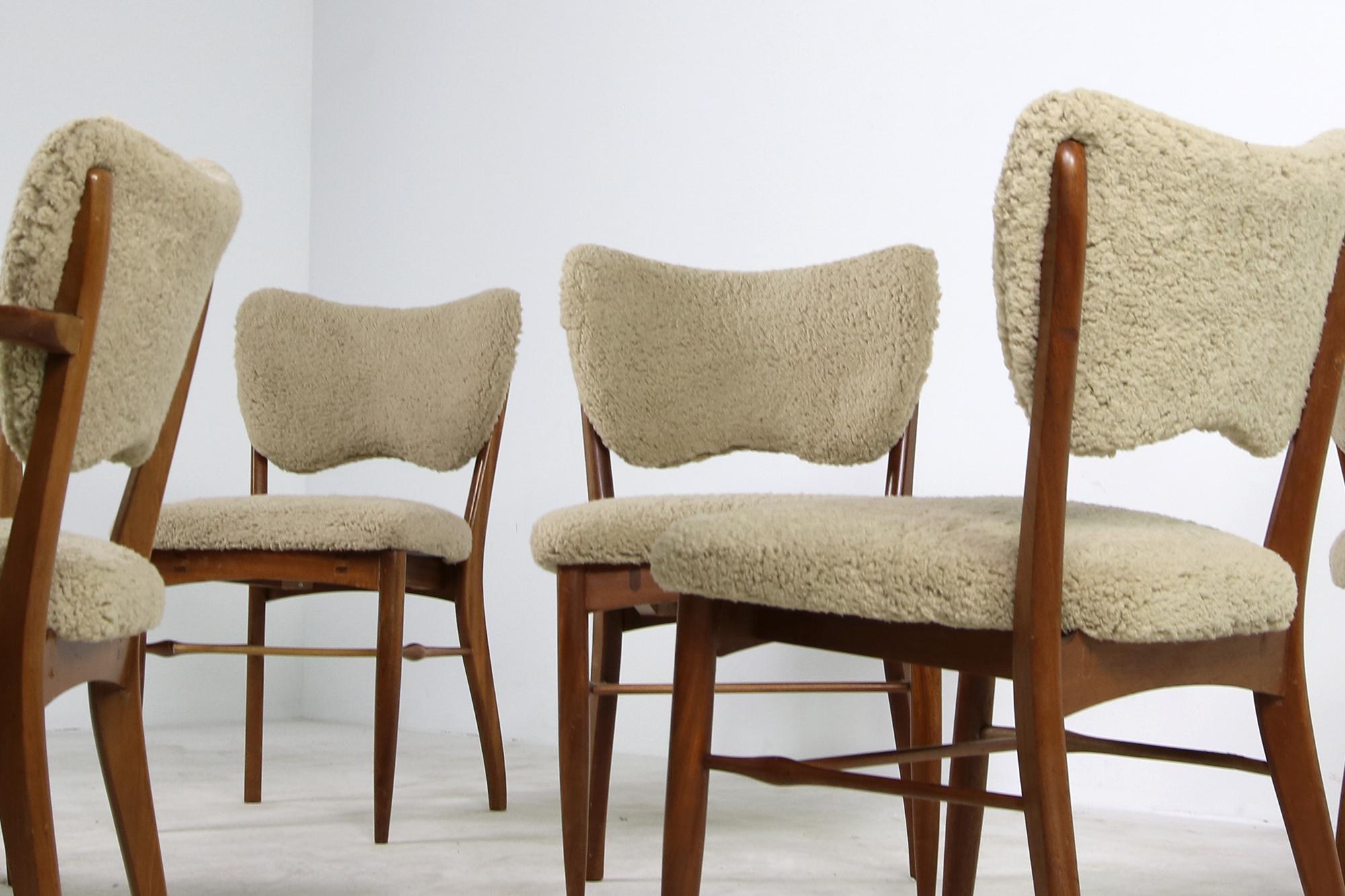 Beautiful set of (6) six rare - in that style unique - 1950s dining room chairs, 2x chairs with armrest, 4x armless chairs. Reupholstered in a super soft teddy fur fabric, like sheepskin but a cotton mix fabric, soft to the touch. The base is made