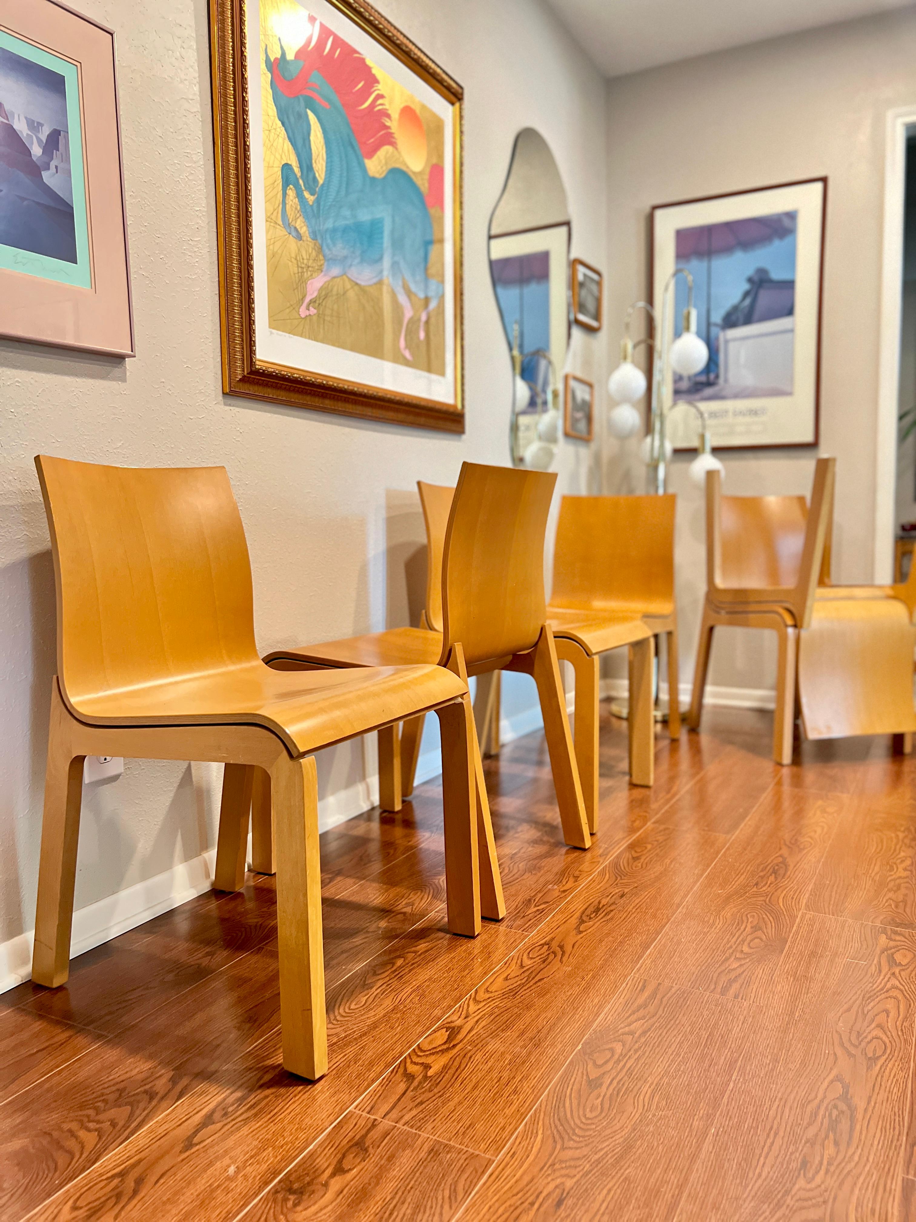 Set of 6 italian Bross beetle dining chairs by Enzo Berti. Designed by Enzo Berti, the Beetle chair offers a simple design to compliment any dining table or breakfast nook. The molded wood frame in beech adds warmth to this modern design. Overall in