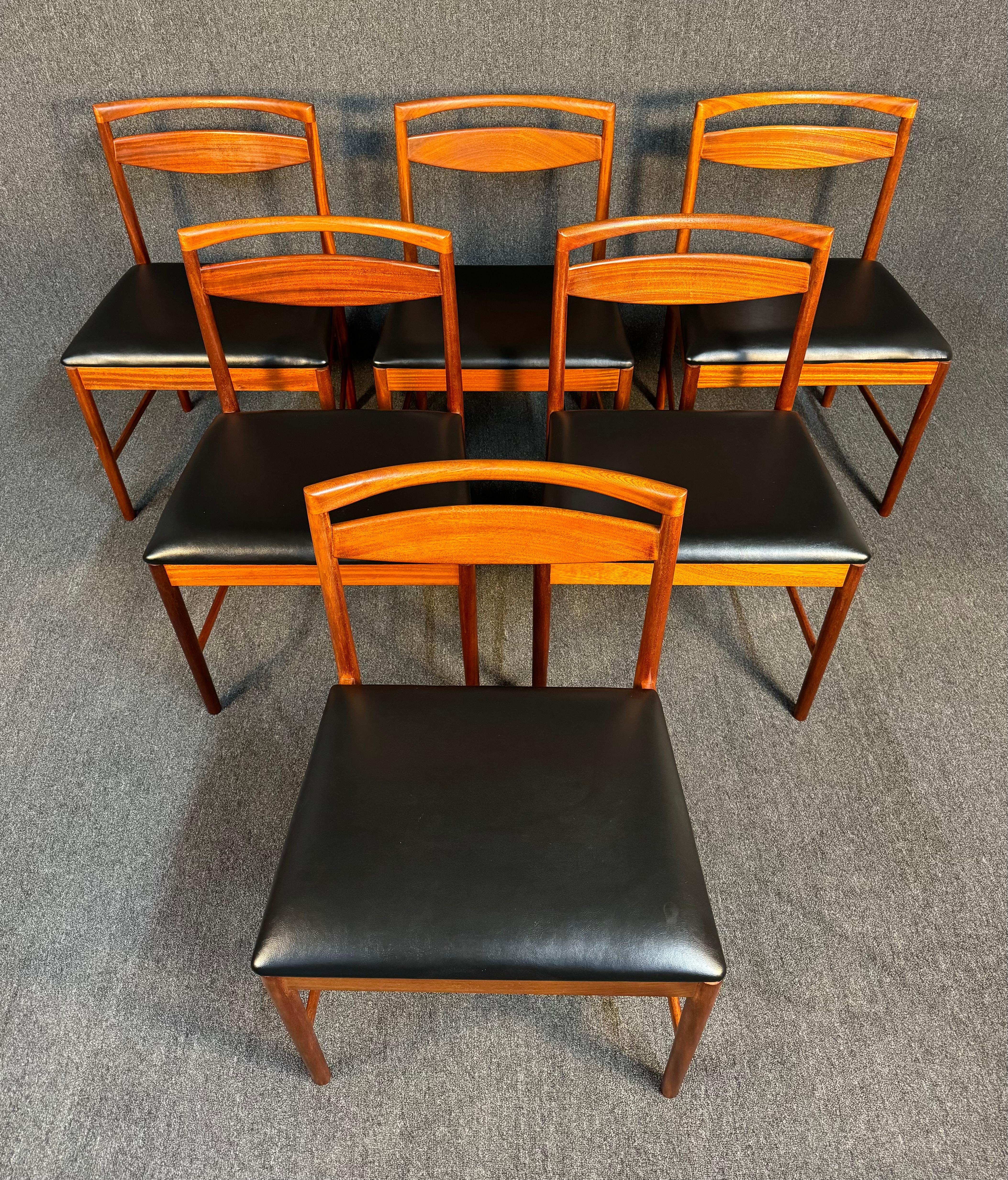 Here is a beautiful set of six British Mid Century Modern dining chairs in mahogany Model 9433 manufactured by A.H. McIntosh in Scotland in the 1960s. This comfortable set, recently imported from Europe to California before its refinishing, features