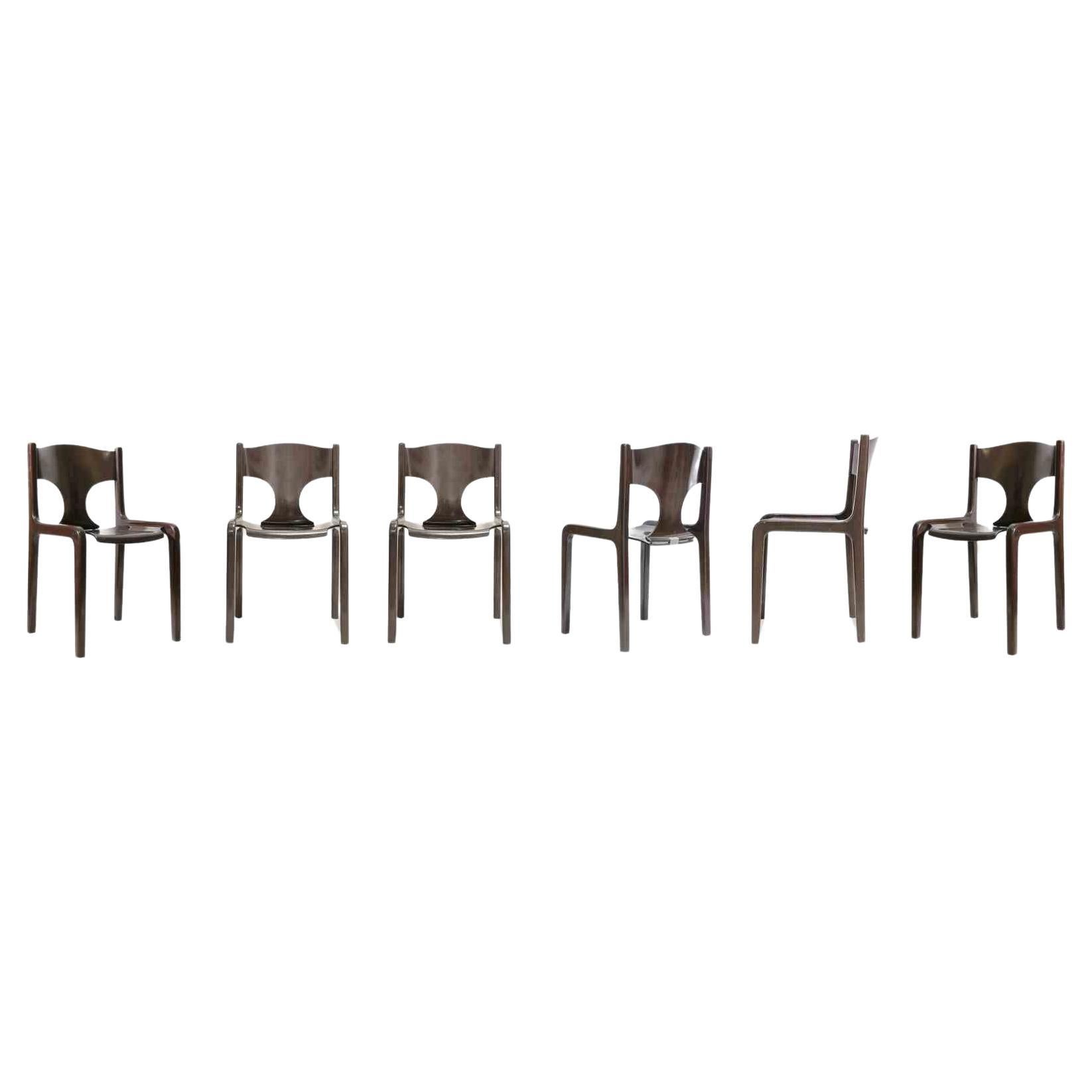 Set of 6 vintage chairs is an orginal design furniture item realized by Augusto Bozzi in the 1970s.

The set is composed by six chairs in wood with brass details.

Augusto Bozzi (1924–1982) was an Italian furniture designer famous for designing