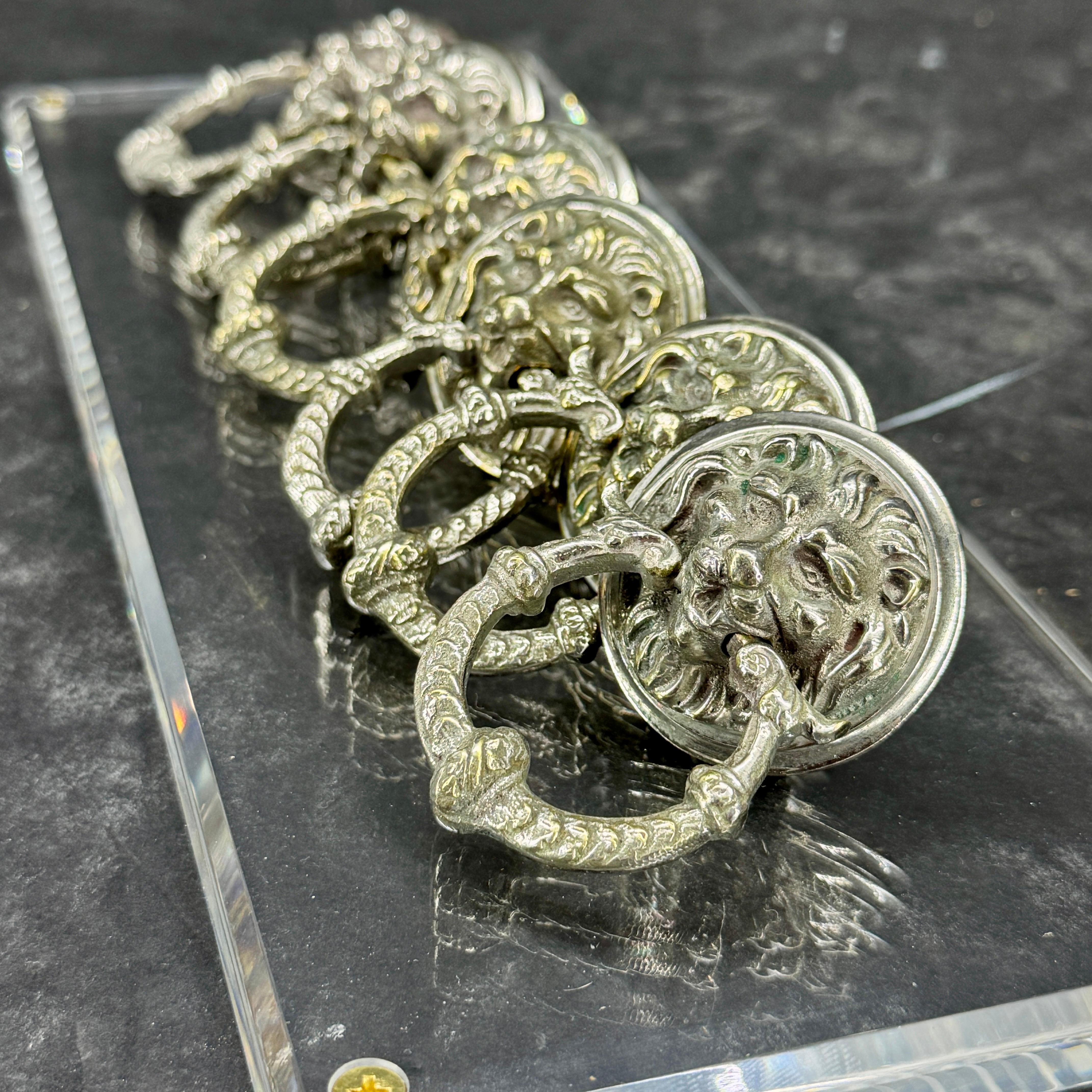 As found in France, a charming set of six vintage drawer pulls featuring lion heads. These are perfect for furniture, door, closet, cabinet, dresser, wardrobe, cupboard or jewelry box. Certainly creates a European vibe wherever placed. 