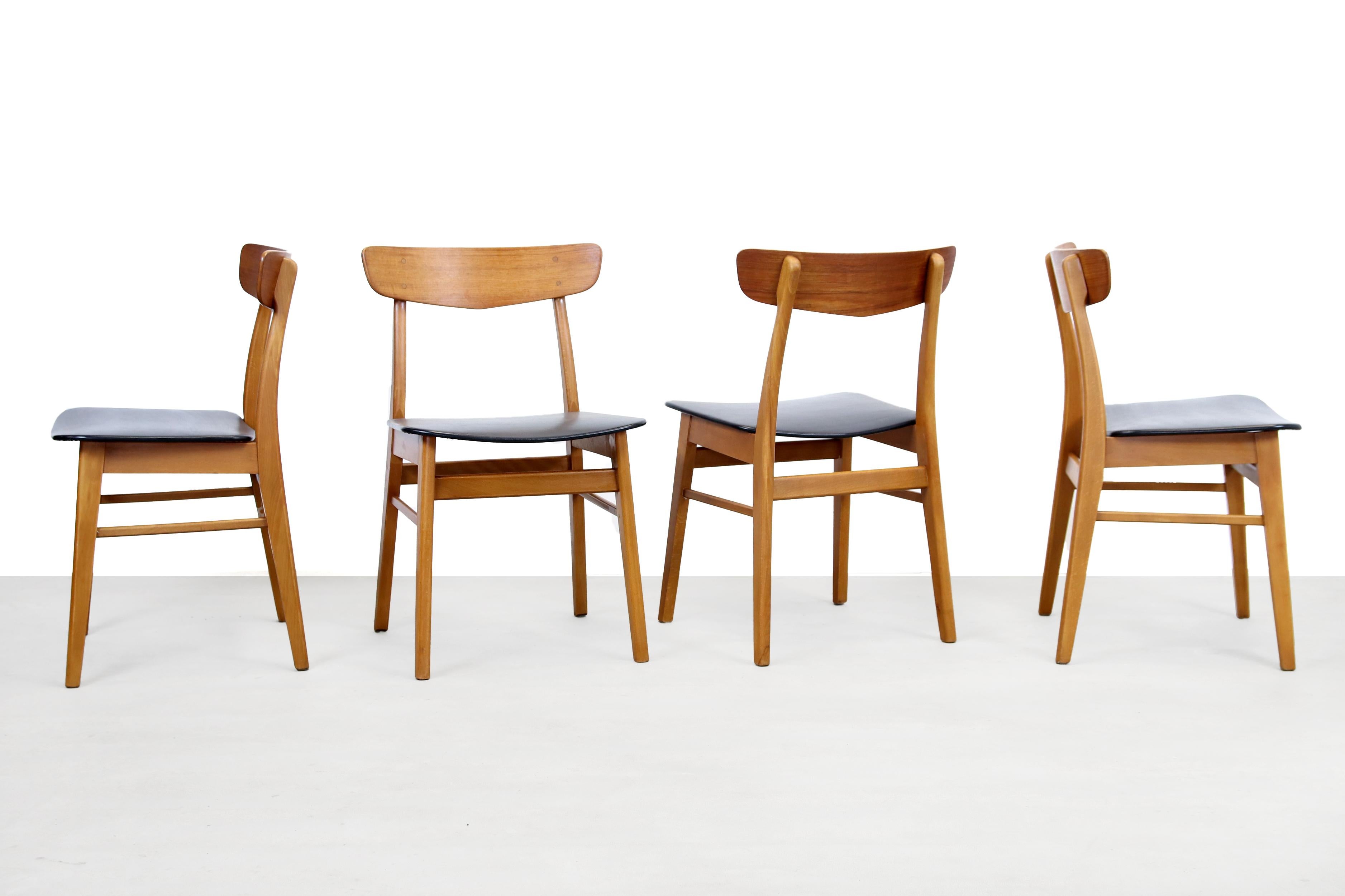 Beautiful set of 6 Farstrup dining room chairs from Denmark. These airily designed chairs from Denmark are made of solid beechwood and teak plywood backrest. The seats are upholstered but the faux leather is damaged, therefore you can choose to