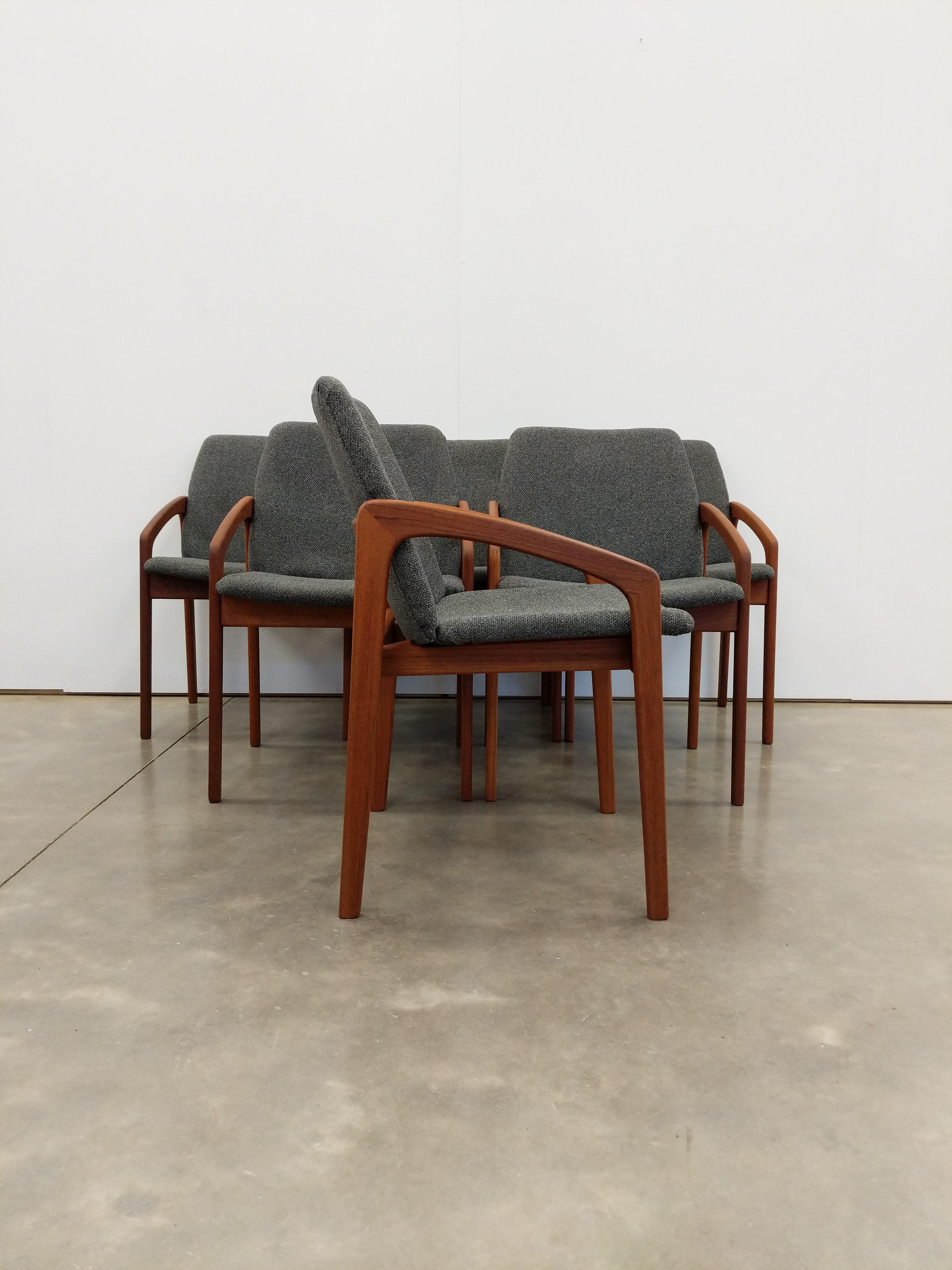 Set of 6 authentic vintage Danish mid century modern teak armchairs / dining chairs.

Model 23 designed by Henning Kjaernulf for Korup Stolefabrik.

Maker's stamp on bottom.

This set is in excellent vintage condition with very few signs of