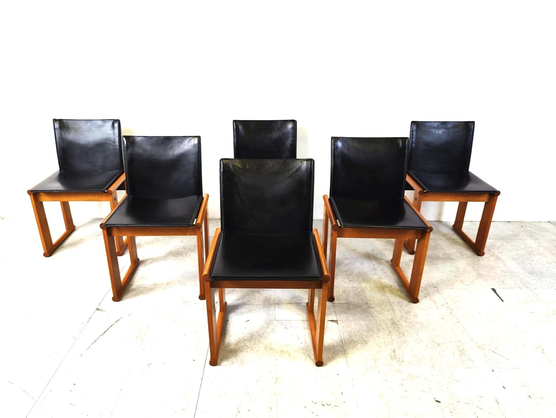 Set of 6 dining chairs designed by Tobia & Afra Scarpa for Molteni.

Beuatiful modern design wooden frames with black leather seats and backrests.

As ever, with Scarpa's designs, we have high quality standards and timeless design.

Good original