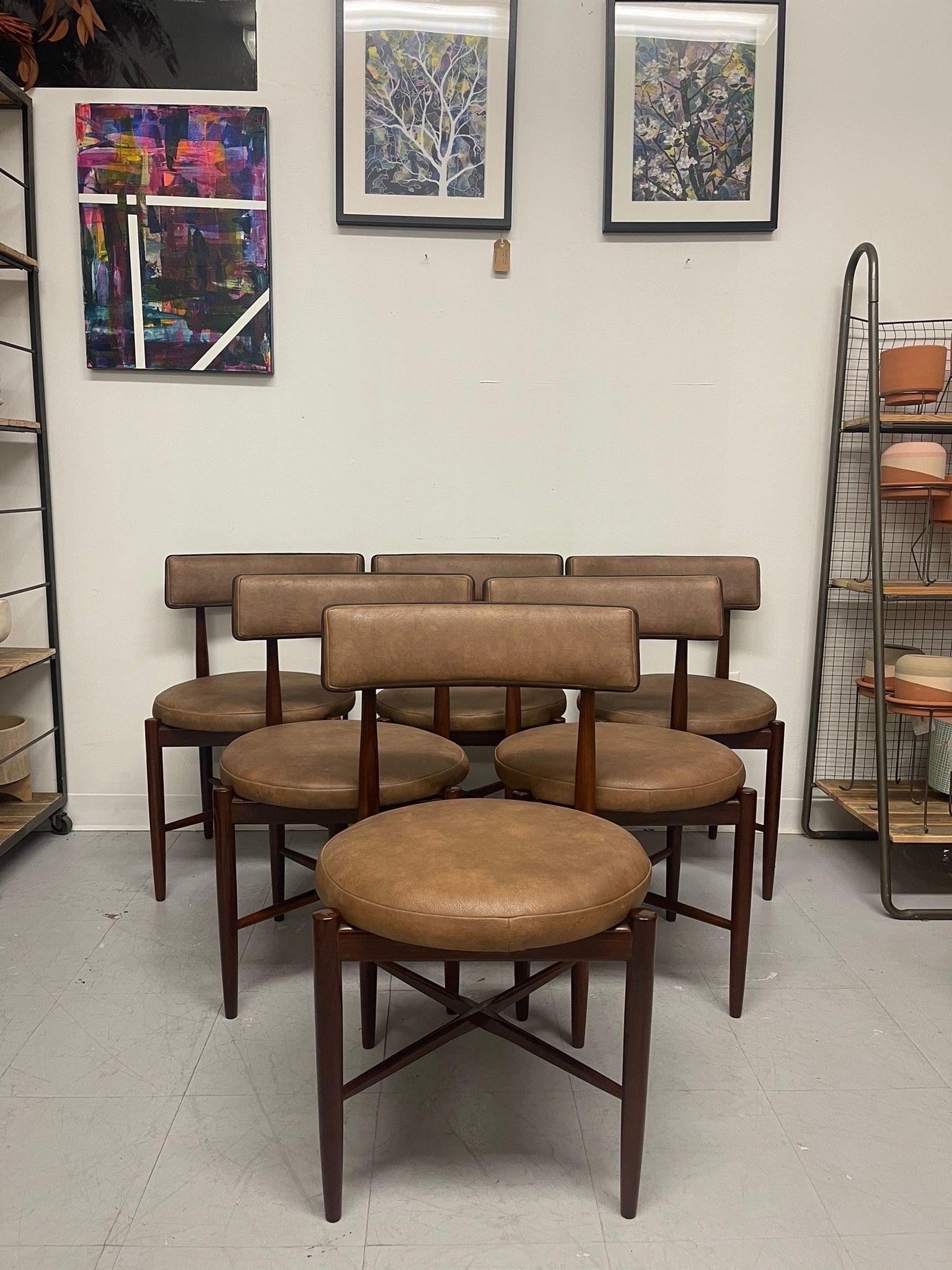 Recent UK Import. Circa 1960s/1970s. Set of 6 Vintage Chairs with Light Brown Seat Cushioning. Possibly Teak or Walnut Wood Based on Maker. Classic G-Plan Design with Tapered Legs and X Reinforcement on the Legs. Vintage Condition Consistent with