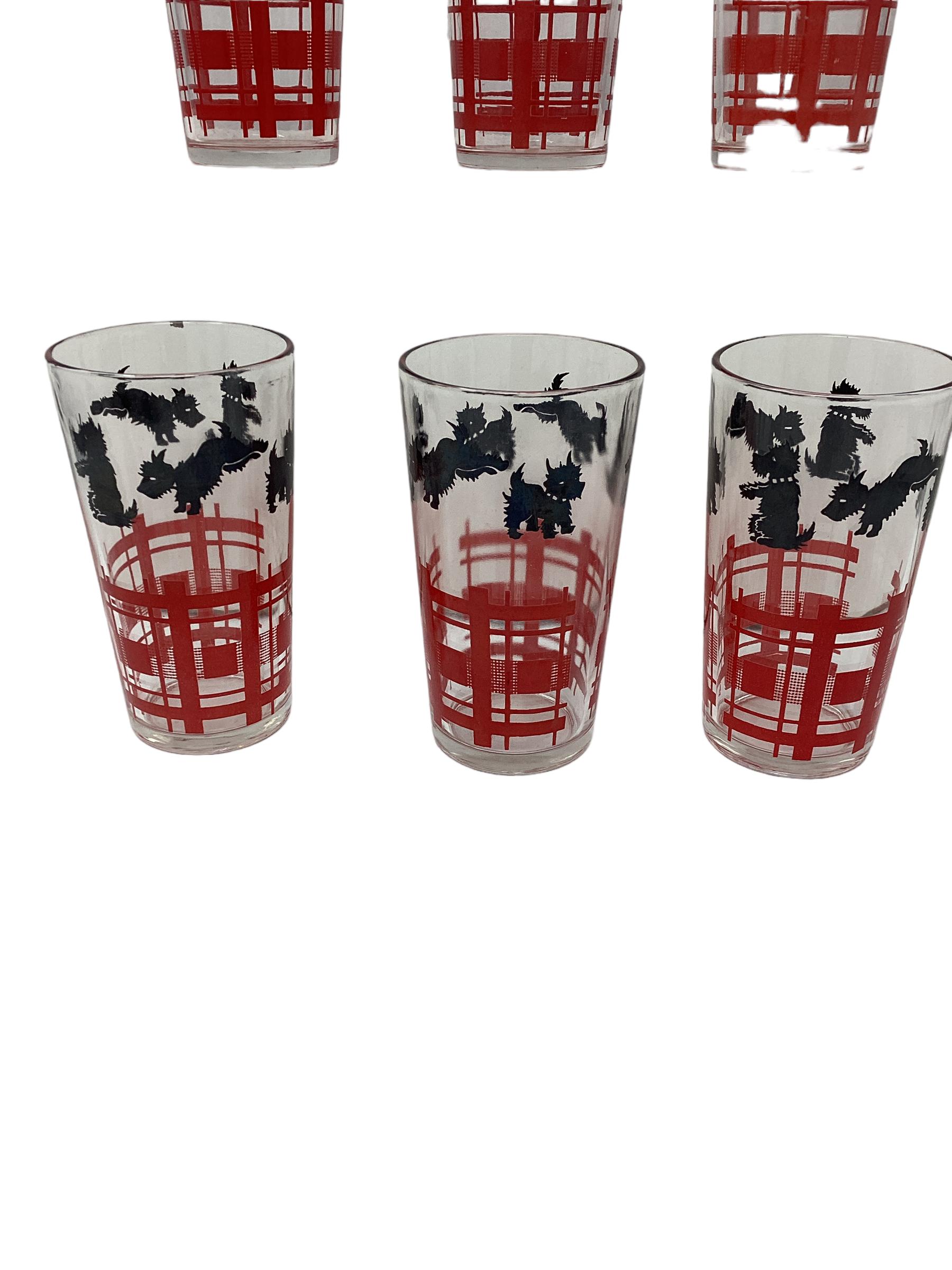 Set of 6 Vintage Hazel Atlas Scotty Tumblers. Playful black scotties in various jumping pose leaping over a red enamel fence. 
We have 3 sets available in this pattern.