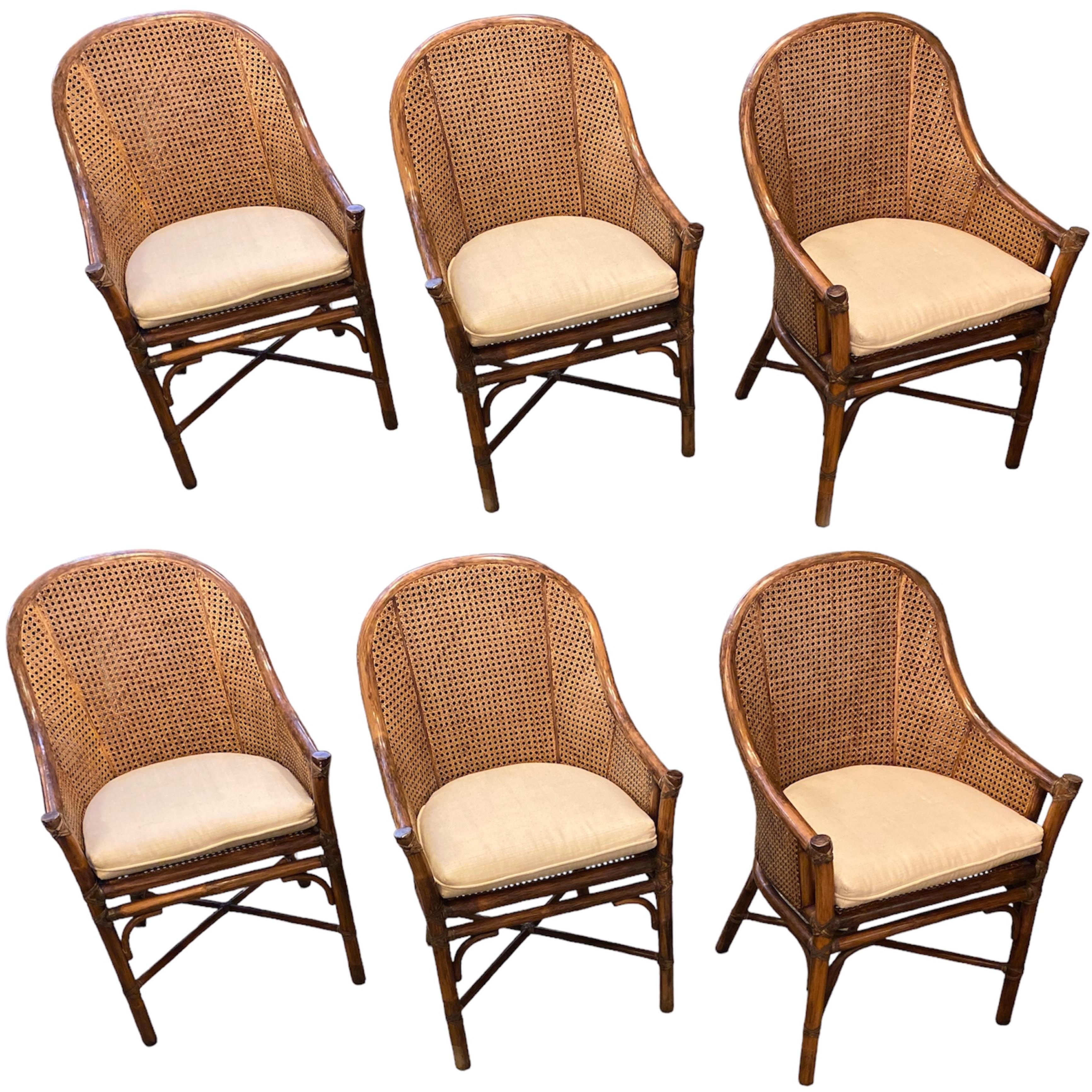 Set of 6 McGuire Rattan Cane Dining Chairs 
1970’s Double caning barrel back with arm panels. Removable cushions.
Very minimal wear for age and use great vintage condition .
(matching McGuire table listed if interested)
