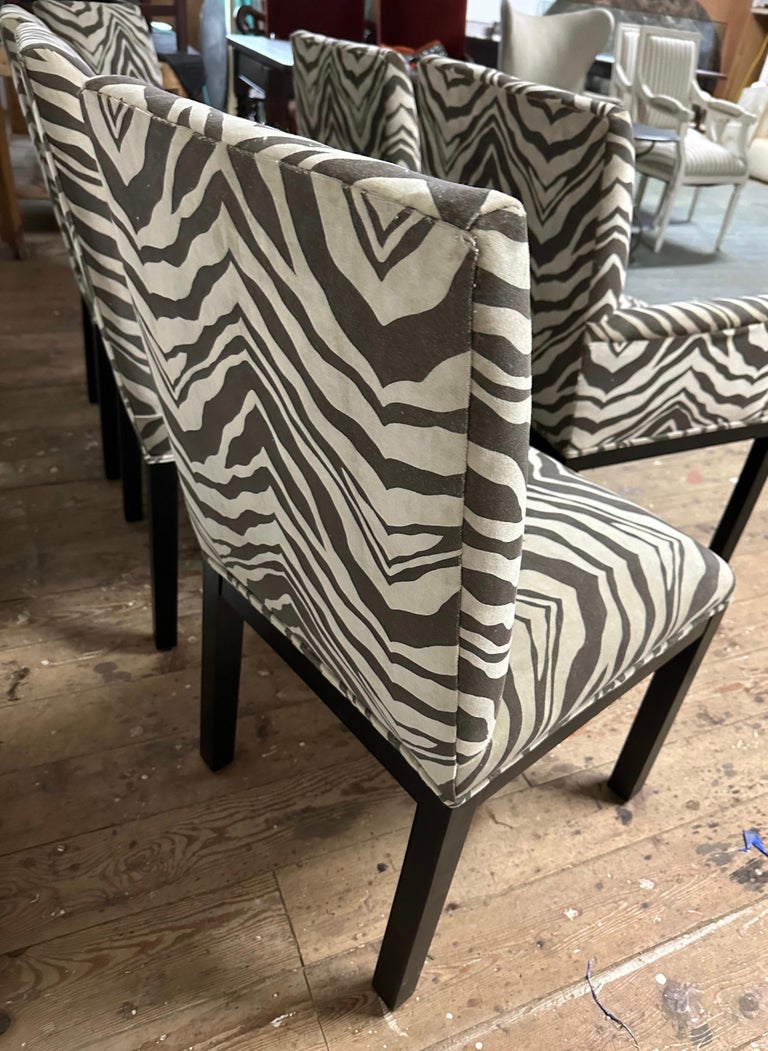 In the style of Milo Baughman, this simple, modern contemporary set of 6 classic Parsons decorator dining chairs have been newly refinished and re-covered in velvet zebra design fabric. The chairs have ebonized heavy solid wood framing with