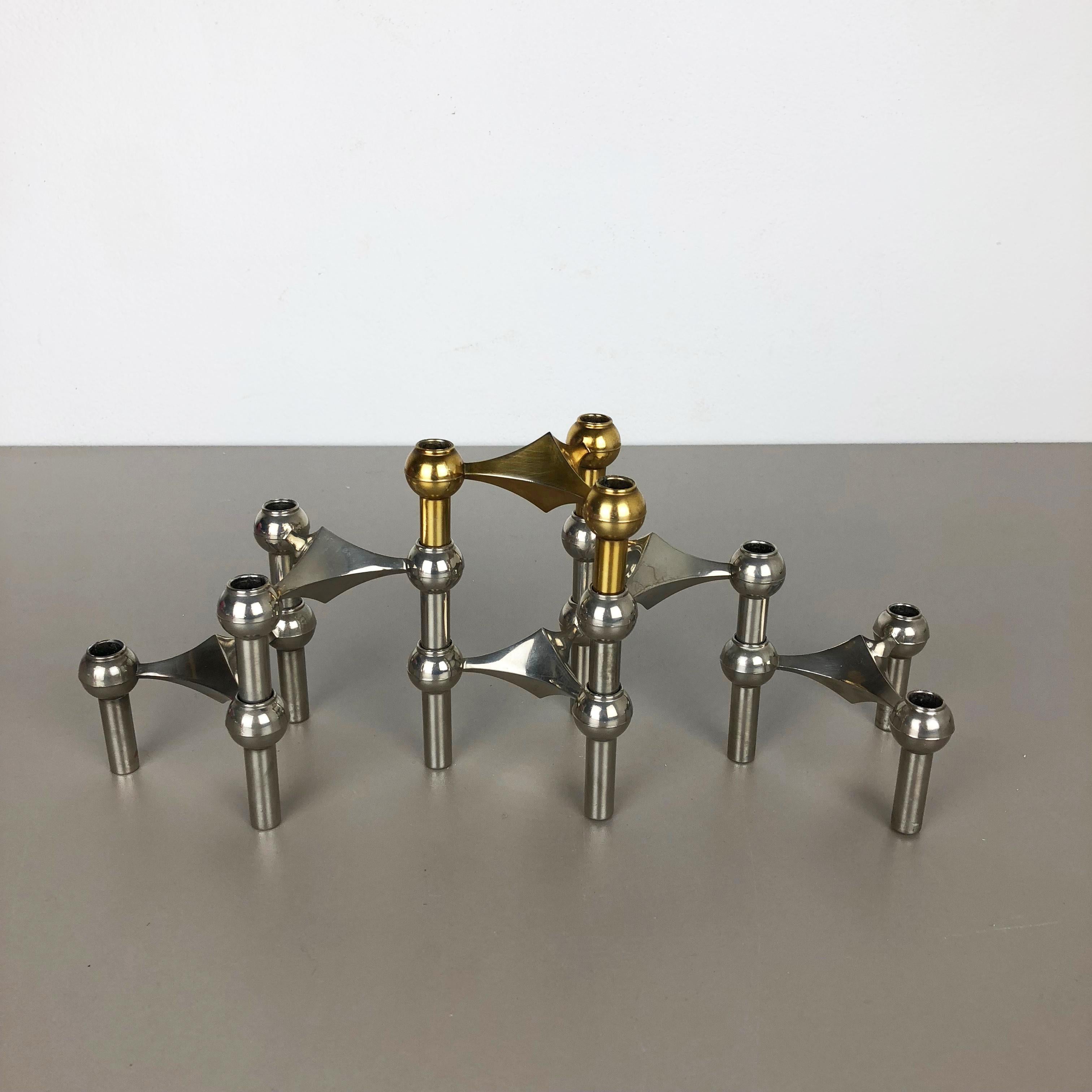 Article:

6 metal candle holder elements


Producer:

BMF Nagel, Germany



Description:

This original vintage set of 6 metal candleholders was produced in the 1970s in Germany by BMF Nagel. Due to the 3 stacking option of each candle