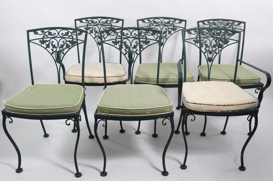 Nice clean set of patio, garden dining chairs by Woodard. This impressive set is in very fine, clean, original condition, the set includes 4 side and 2 armchairs and the removable seat pad cushions. Hard to find sets of six still intact.
Measures: