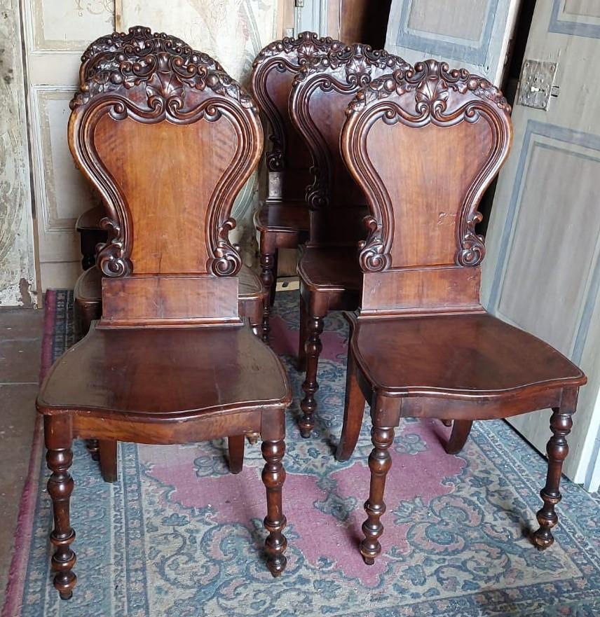 set of 6 antique chairs in solid walnut wood, richly carved with a particular backrest, original from the late 19th century, originating in Italy. Ideal as dining table chairs, perhaps in contrasting style, Dimensions each cm w 46 x H 103 x D 44