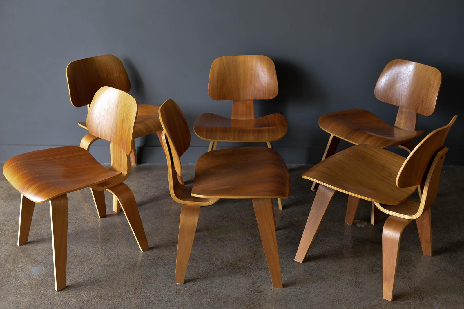Set of 6 authentic walnut eames for Herman Miller DCW Chairs. Beautiful matching set of walnut Charles and Ray Eames DCW (dining chair wood) dining chairs. Excellent original condition with only slight wear, no major scratches. Shock mounts are in