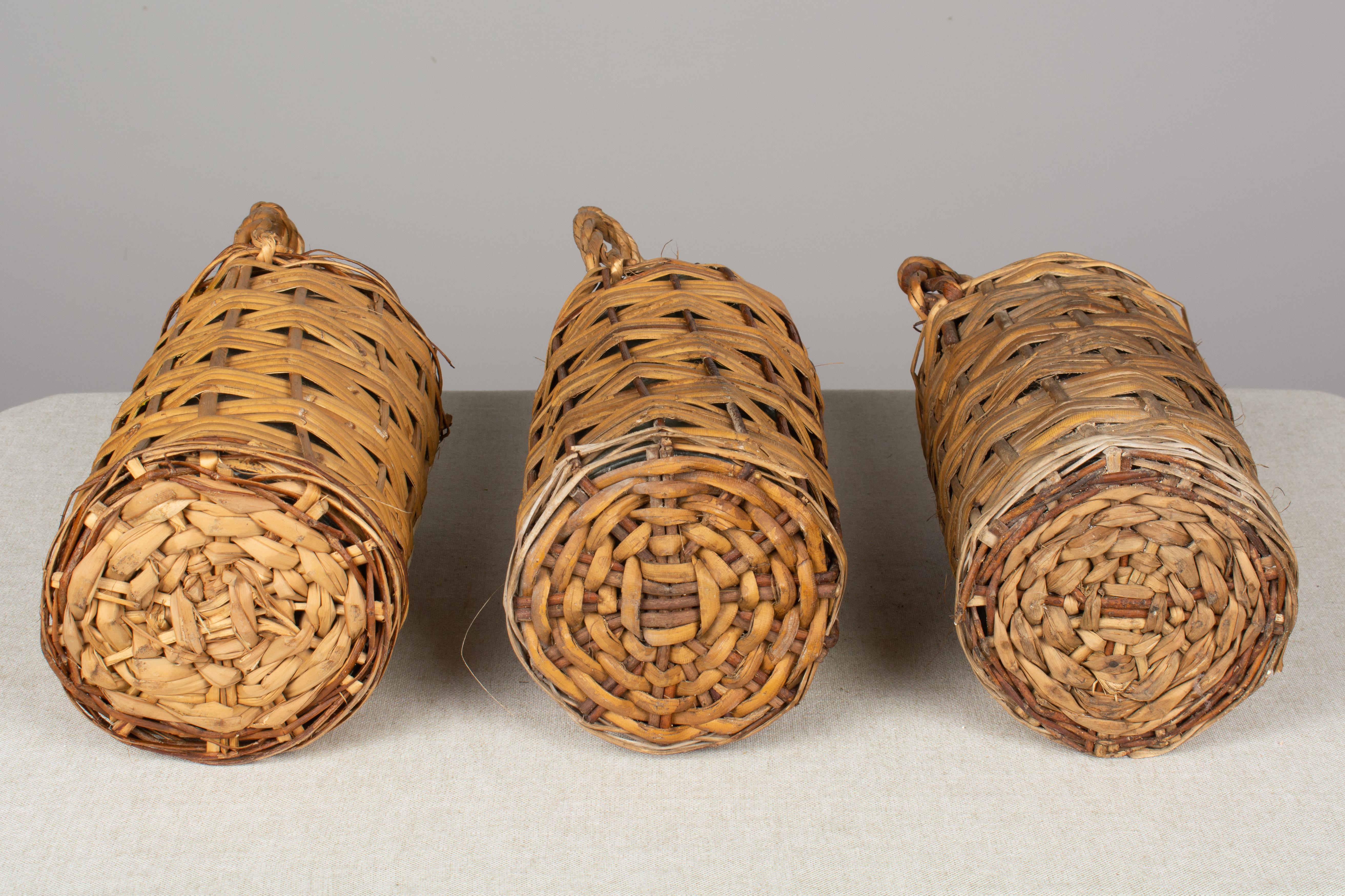 Set of 6 Wicker Wrapped Glass Bottles In Good Condition In Winter Park, FL