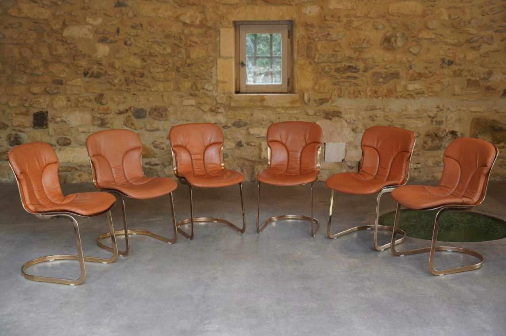 Chic set of 6 matching cognac brown leather chairs designed by Willy Rizzo for Cidue, Italy 1970’s.

All in excellent vintage condition. Excellent patina to the leather commensurate with age. Chair sits atop brass cantilever legs. 

Wonderful