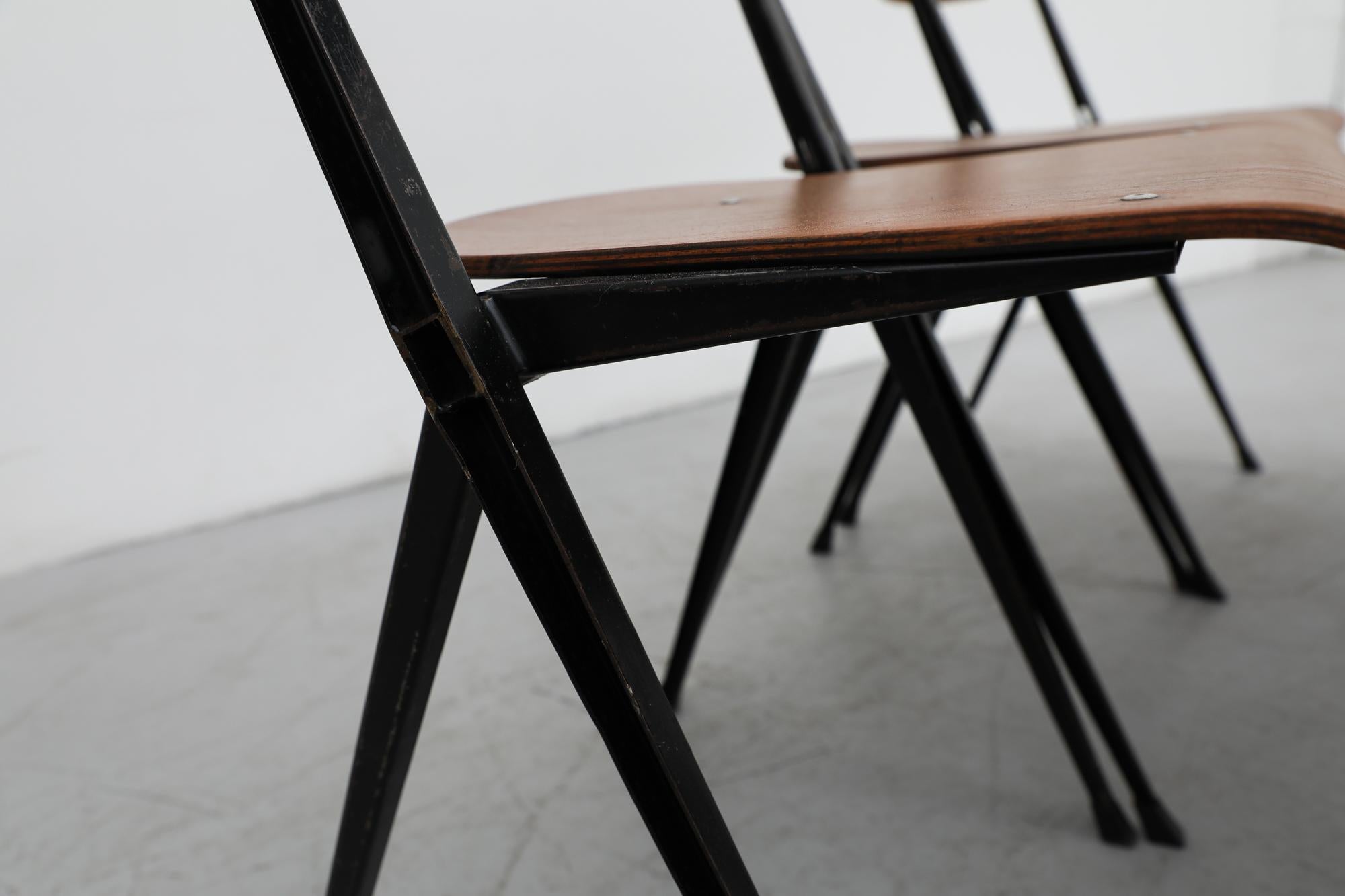 Set of 6 Wim Rietveld Pyramid Stacking Chairs in Teak with Black Metal  Frame For Sale 10