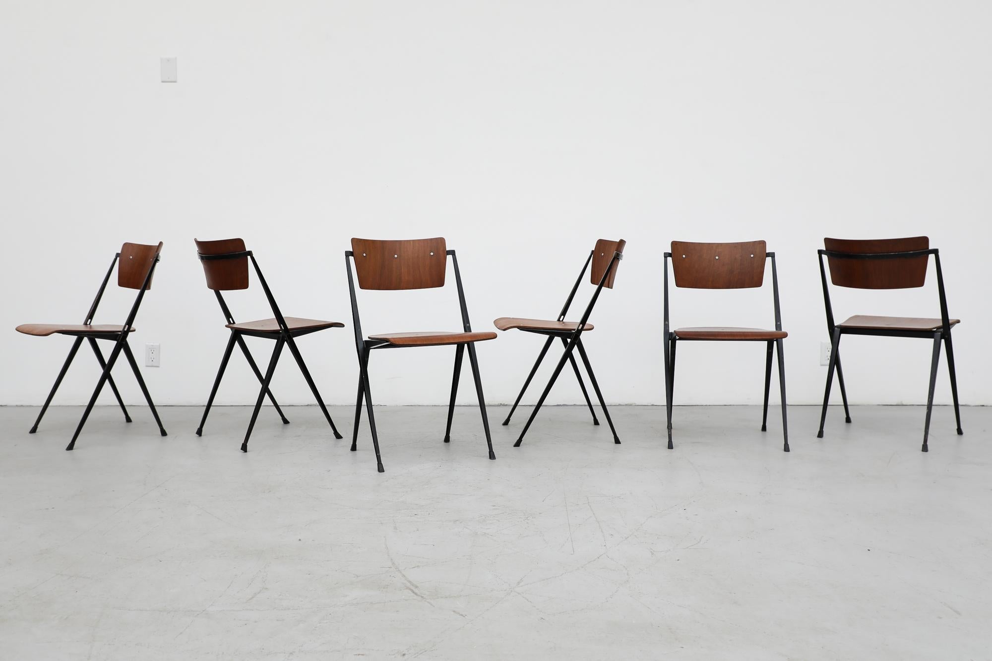 Beautiful set of 6 Wim Rietveld 'Pyramid' stacking chairs for Ahrend de Cirkel. Rewarded with the 1960 ‘Signe d’Or’ Design Award these extremely durable and comfortable chairs are in original condition with some visible wear consistent with their