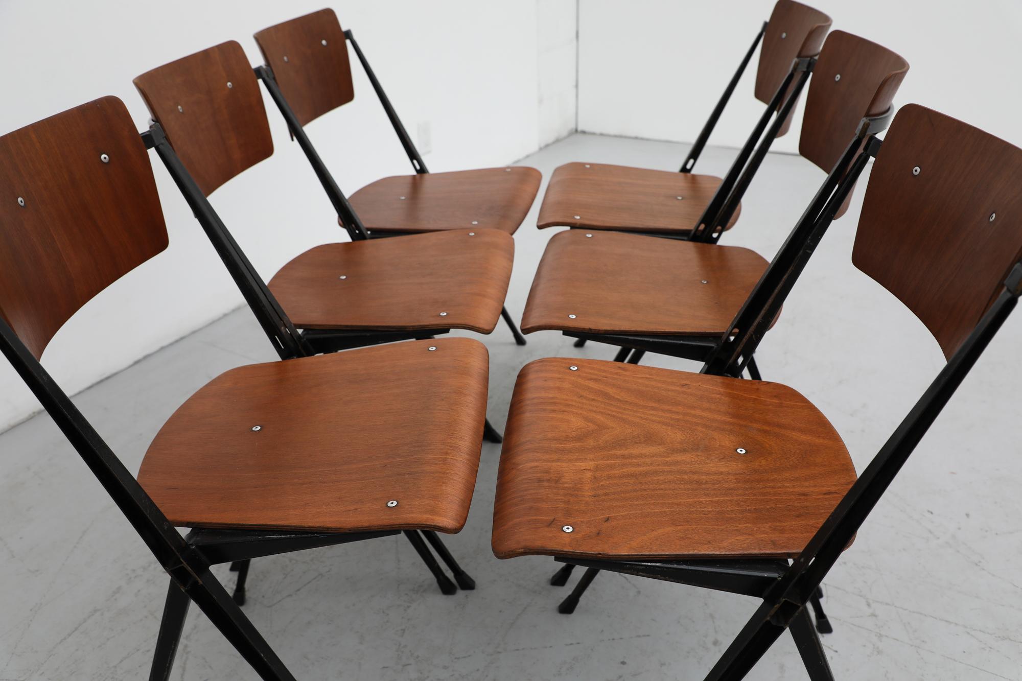 Mid-Century Modern Set of 6 Wim Rietveld Pyramid Stacking Chairs in Teak with Black Metal  Frame For Sale
