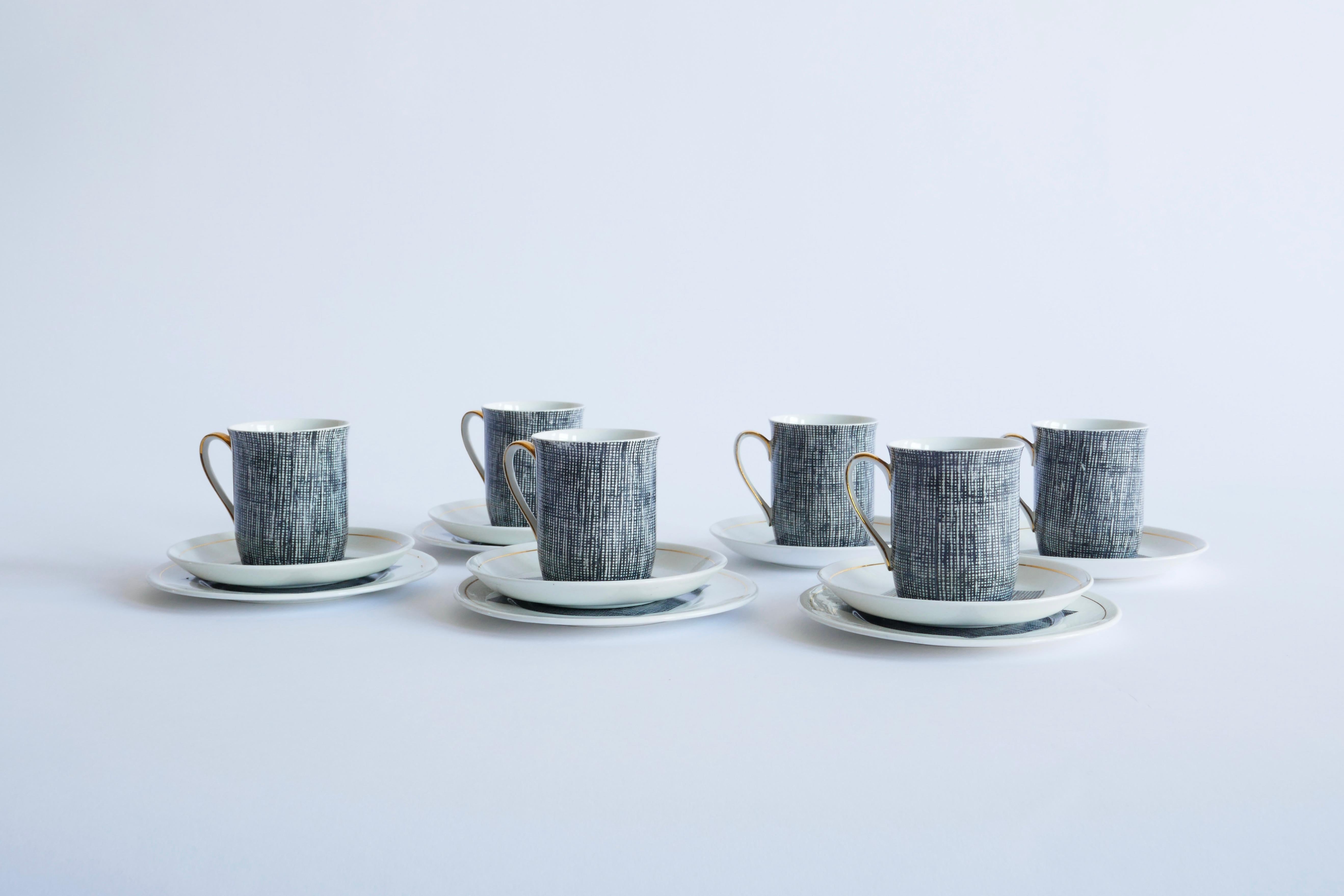 Windsor bone China set of 6 coffee cups with saucers and matching dessert plates

Gold details on the handles and rims, cross hatching black and white pattern with gold trim on a bone china base makes this set beautifully contemporary. 

Made in