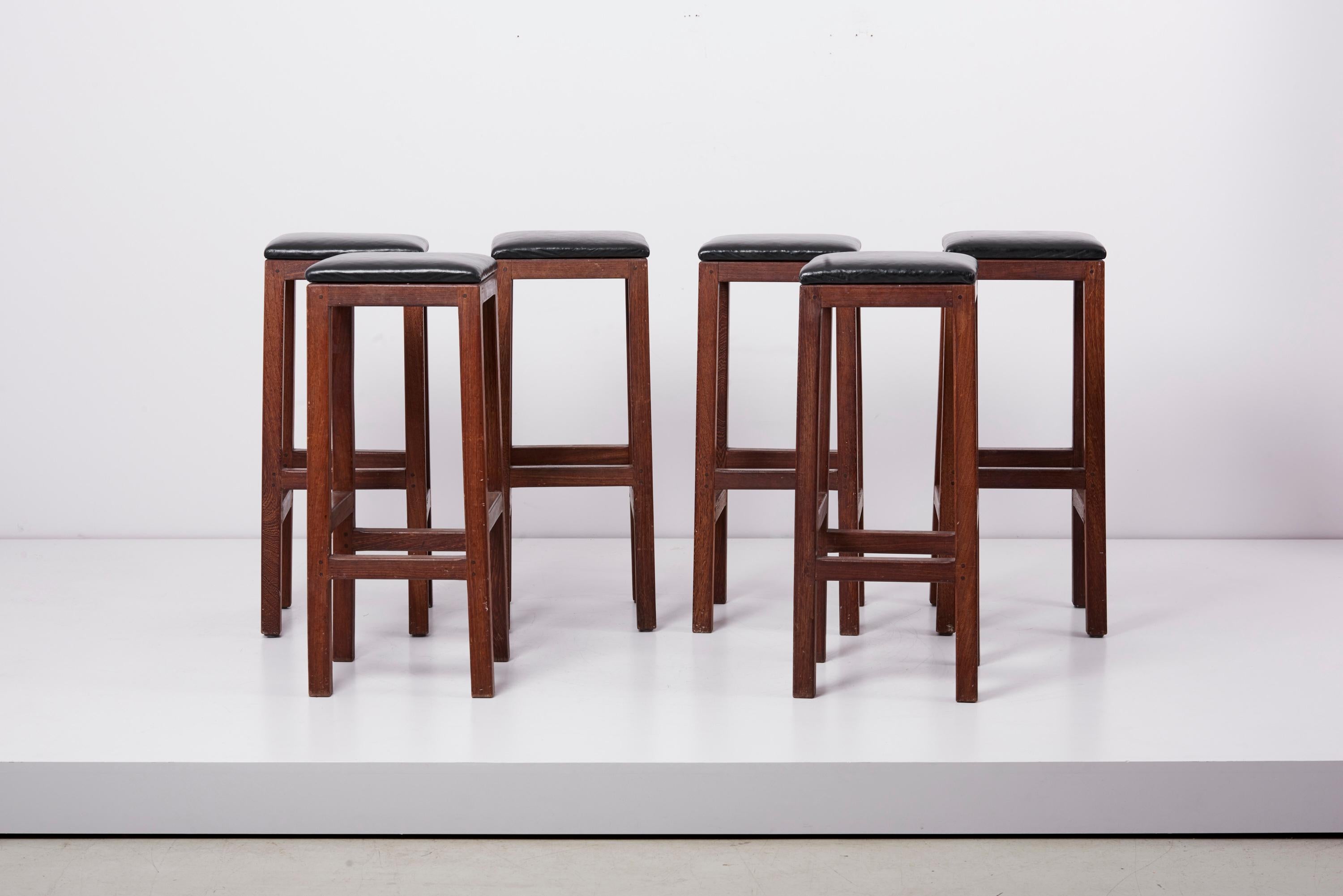 Set of six Mid-Century Modern barstools in good authentic vintage condition. Made of wood and leather.