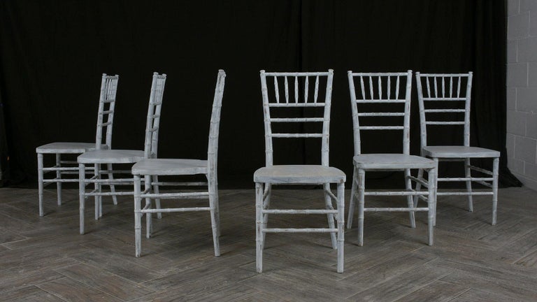 This lovely Set of Six Dining Chairs is made out of solid wood with a carved faux bamboo design throughout the frame is in good condition and has been newly restored by our team of expert craftsmen. All the chairs have been newly painted in an