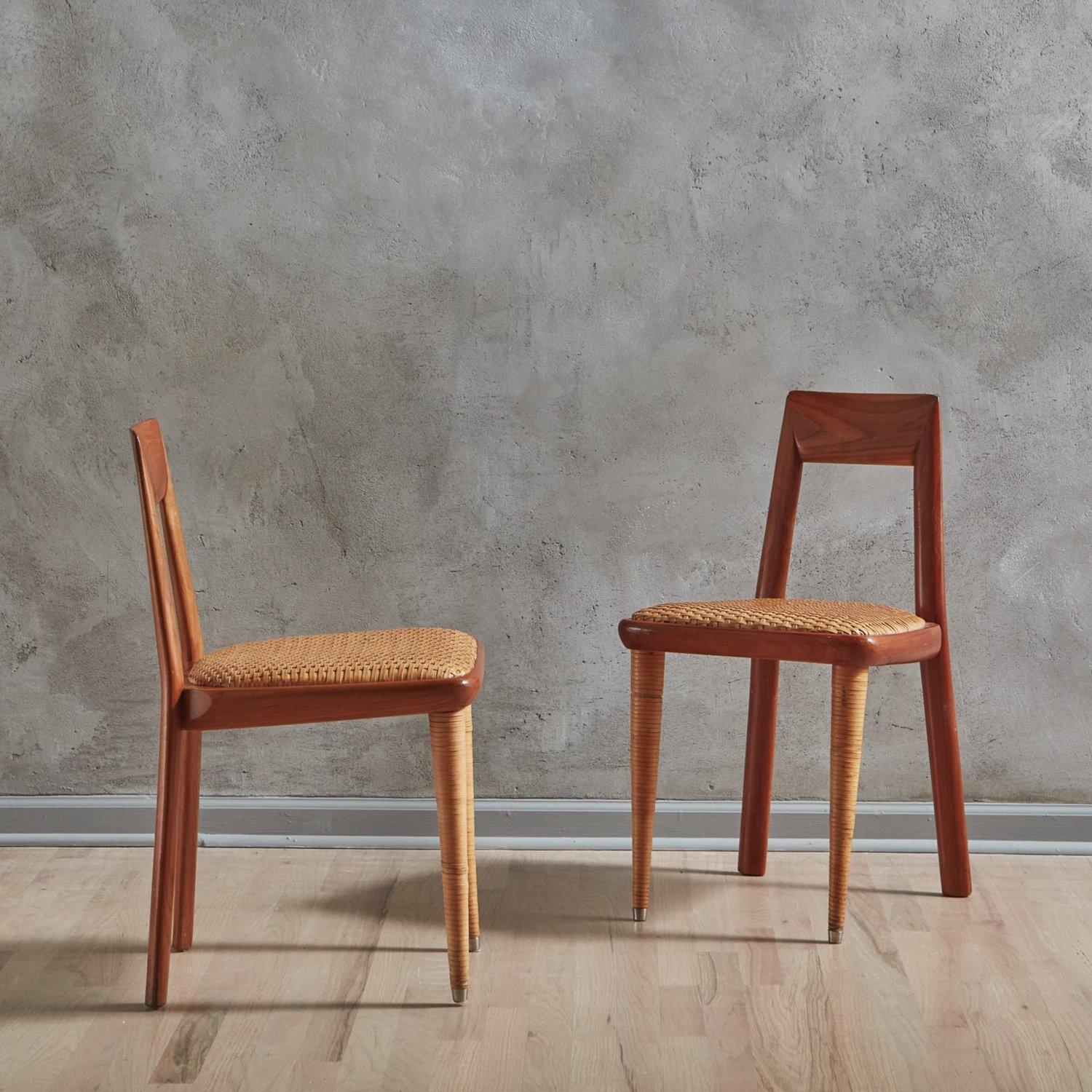 A set of 8 Mid Century Italian dining chairs by Pierantonio Bonacina. These chairs feature angular wood frames with beautiful graining and open seat backs. They have woven leather seats and tapered front legs, which are wrapped in coordinating