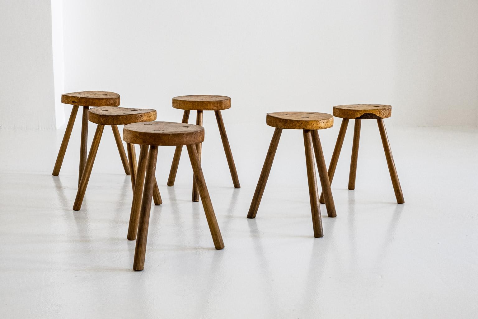 Set of six tripod stools which can also used as side tables. From Italy, with a lovely patina.