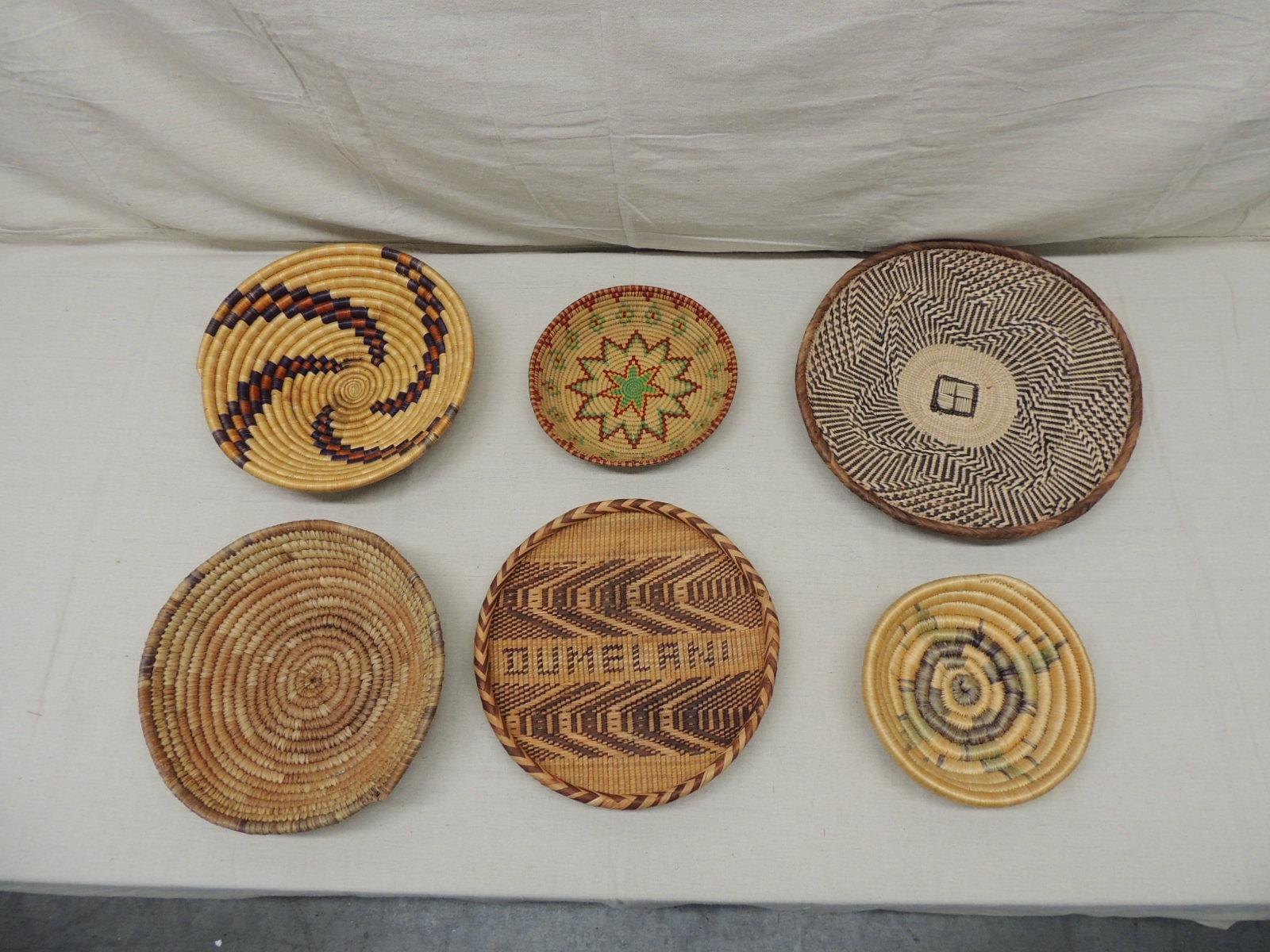 From left to right:
Top:
#1
Artisanal hand woven basket with tribal designs and patterns all around.
(Is not flat is more like a deep bowl shape)
Africa, 1990s.
Size: 12.5