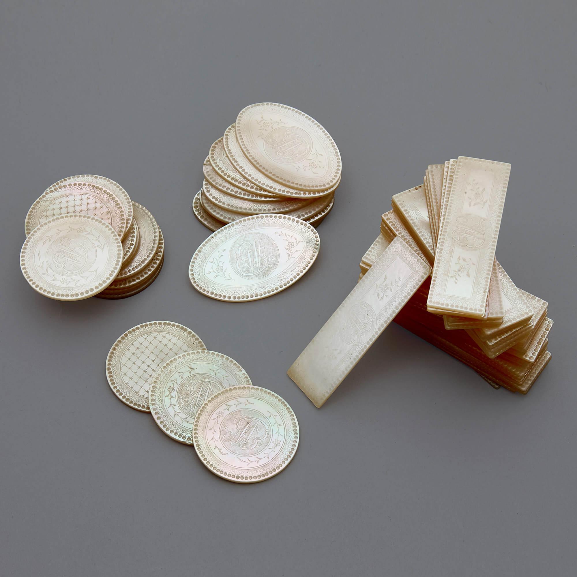Set of 63 Qing Dynasty Chinese mother of pearl counters
Chinese, early 19th century
Measure: Diameter 3.5cm

This set comprises sixty-three mother of pearl gaming counters from the Qing dynasty. There are thirty-nine rectangular counters,