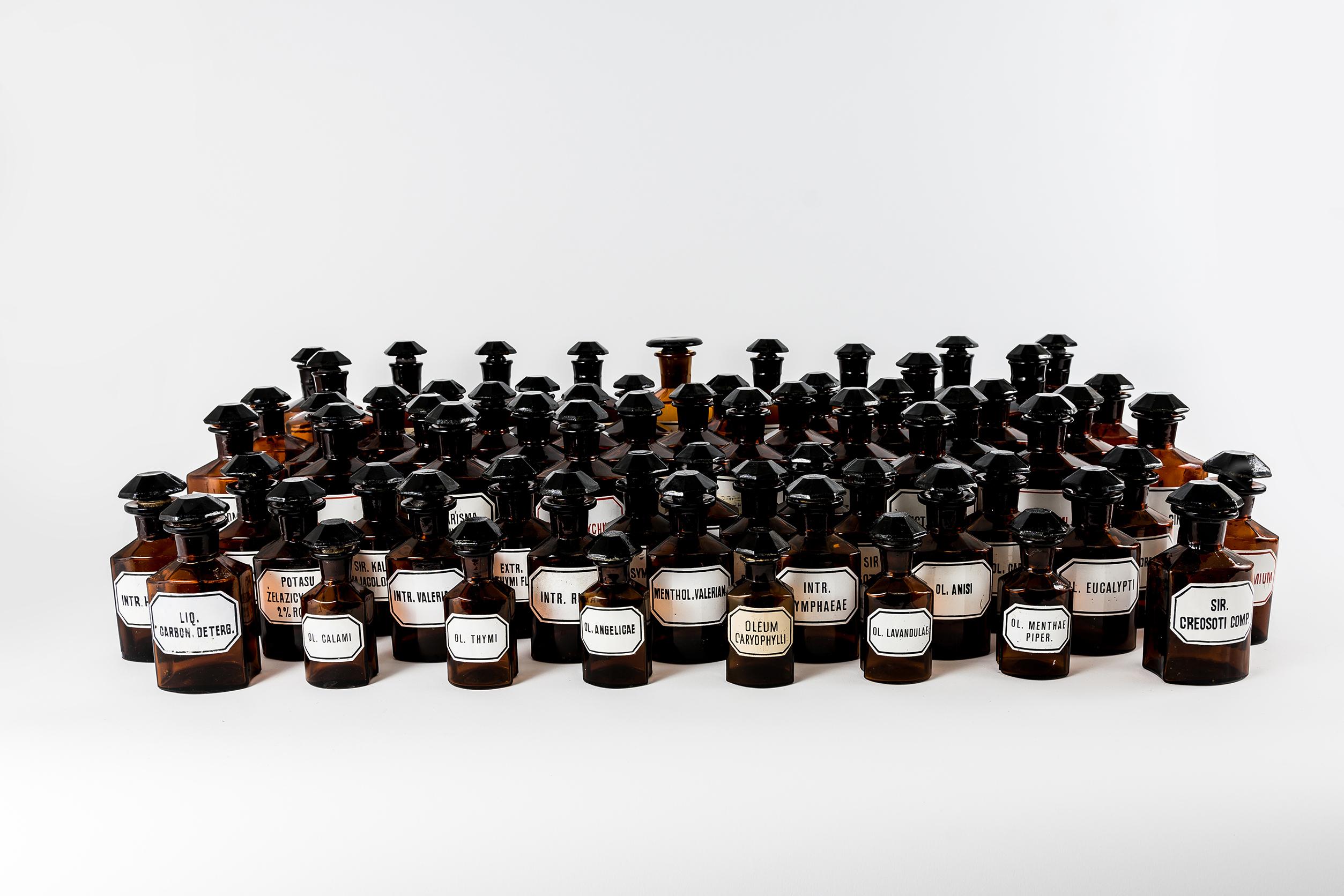 Set of 67 Pharmacy Bottles Amber Glass.
The set:
19cm x 12pcs
16cm x 29pcs
13cm x 21pcs
10cm x 5pcs
All bottles with a solid glass' stoppers.
Bottles have black or red labels or handwritten inscriptions.