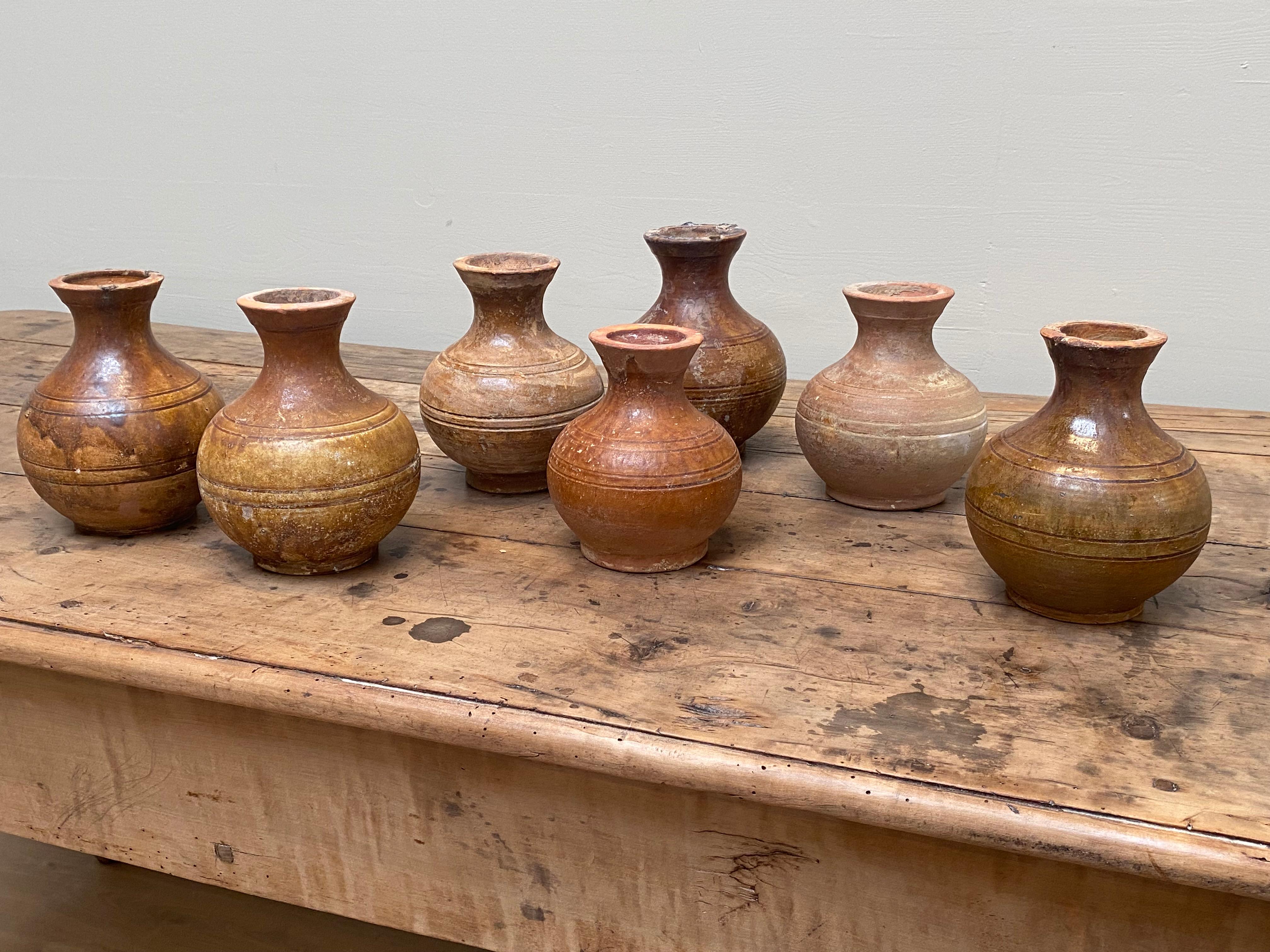 Exceptional  Terracotta Han vases in brown faded color,
China Han Period,approximately 2000 years old,
nice variety of the color brown,
warm and worn shine and correct antique patina, 
set of terracotta full of charm and authenticity.
