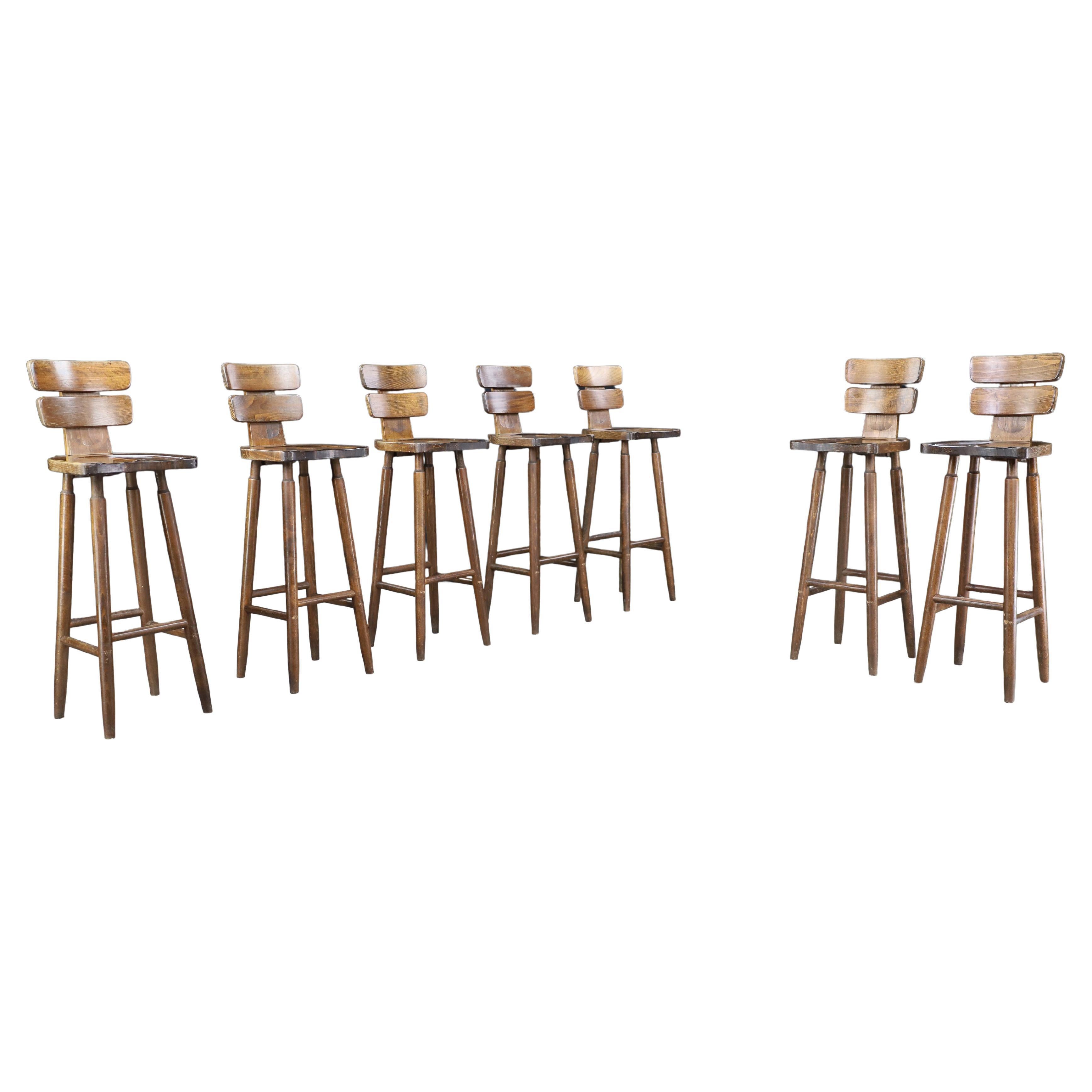Set of 7 Brutalist Bar Stools in Patinated Beechwood, France, 1960s For Sale