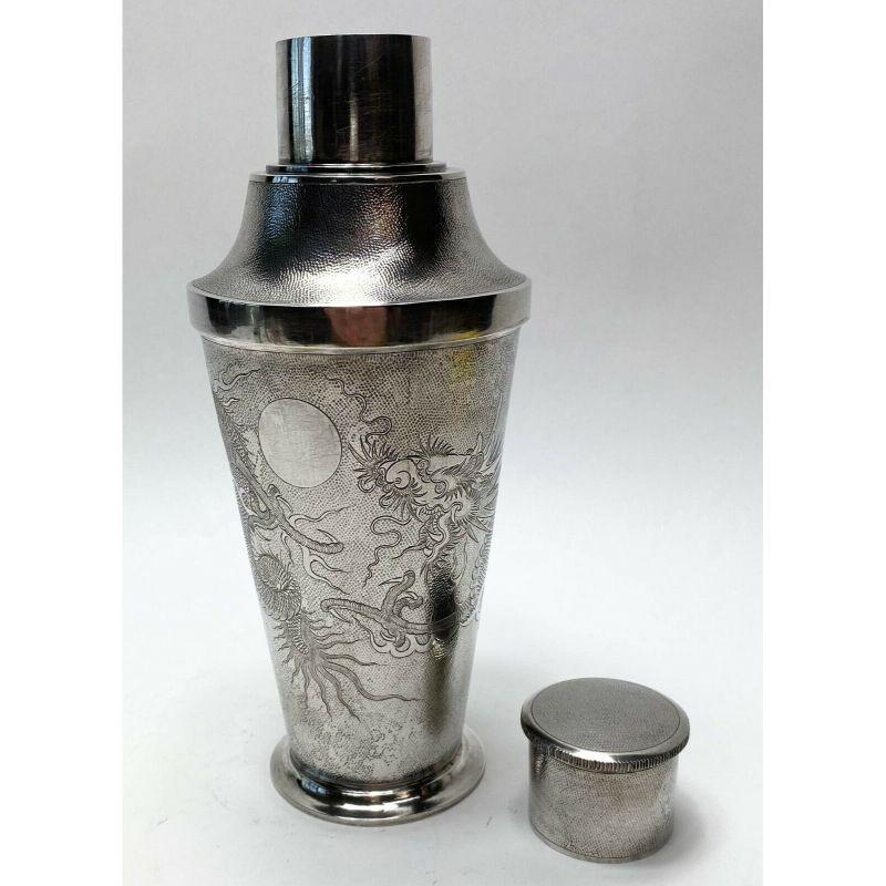 Set of 7 Chinese .900 silver martini shaker & shot cups with dragon motif, circa 1920.

Additional Information:
Material: Silver 
Type: Martini Shaker
Weight Approx., 22.4 ozt
Dimension: Shaker: 4.1 in. diameter x 9.5 in. tall/ Shot glasses: