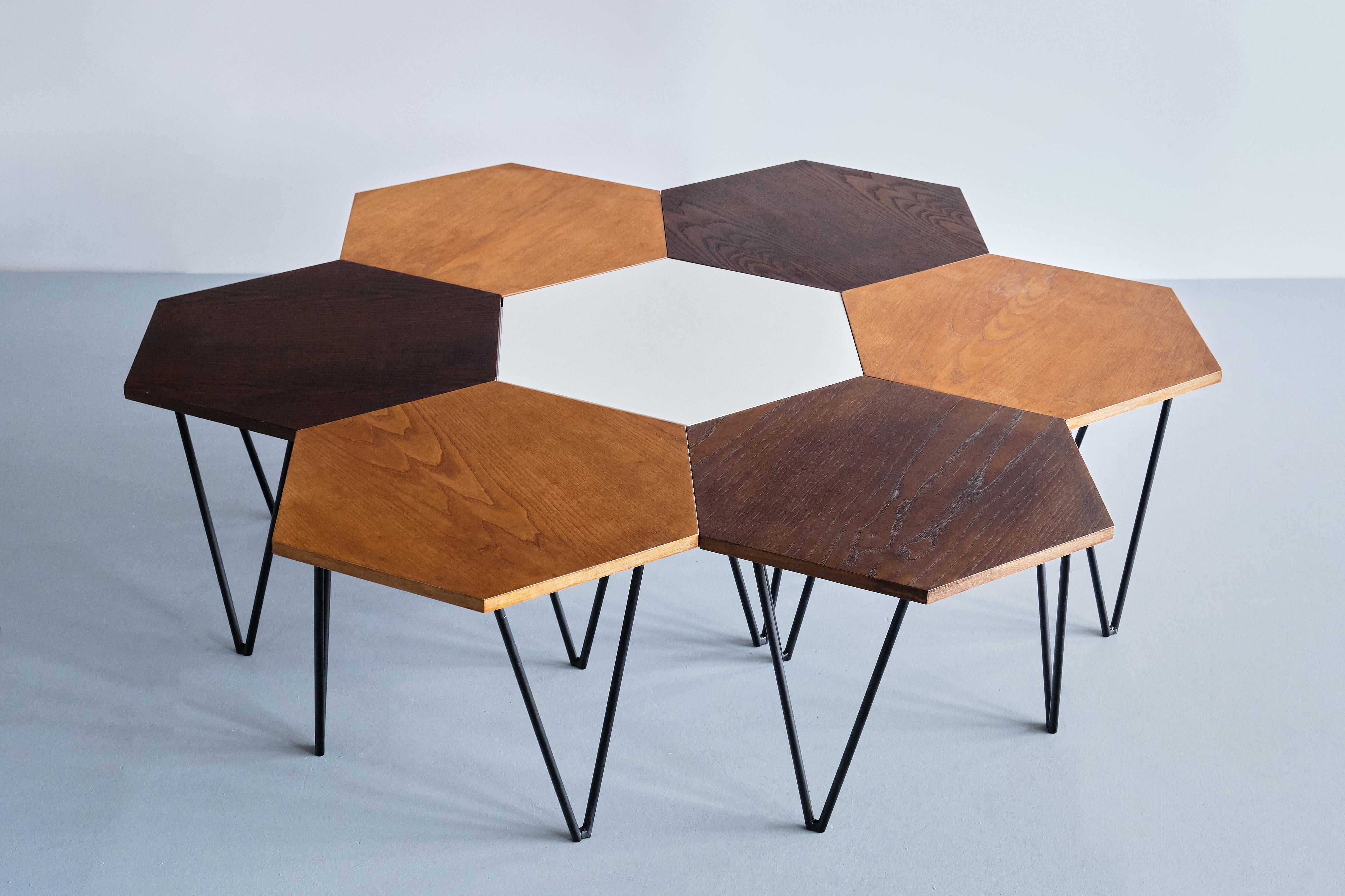 This very rare set of modular coffee tables was designed by Gio Ponti and produced by ISA Bergamo in Italy in the 1950s. Each table is marked with a metal manufacturers tag 'ISA'.

The set consist of 7 tables, each with a hexagonal shaped top,