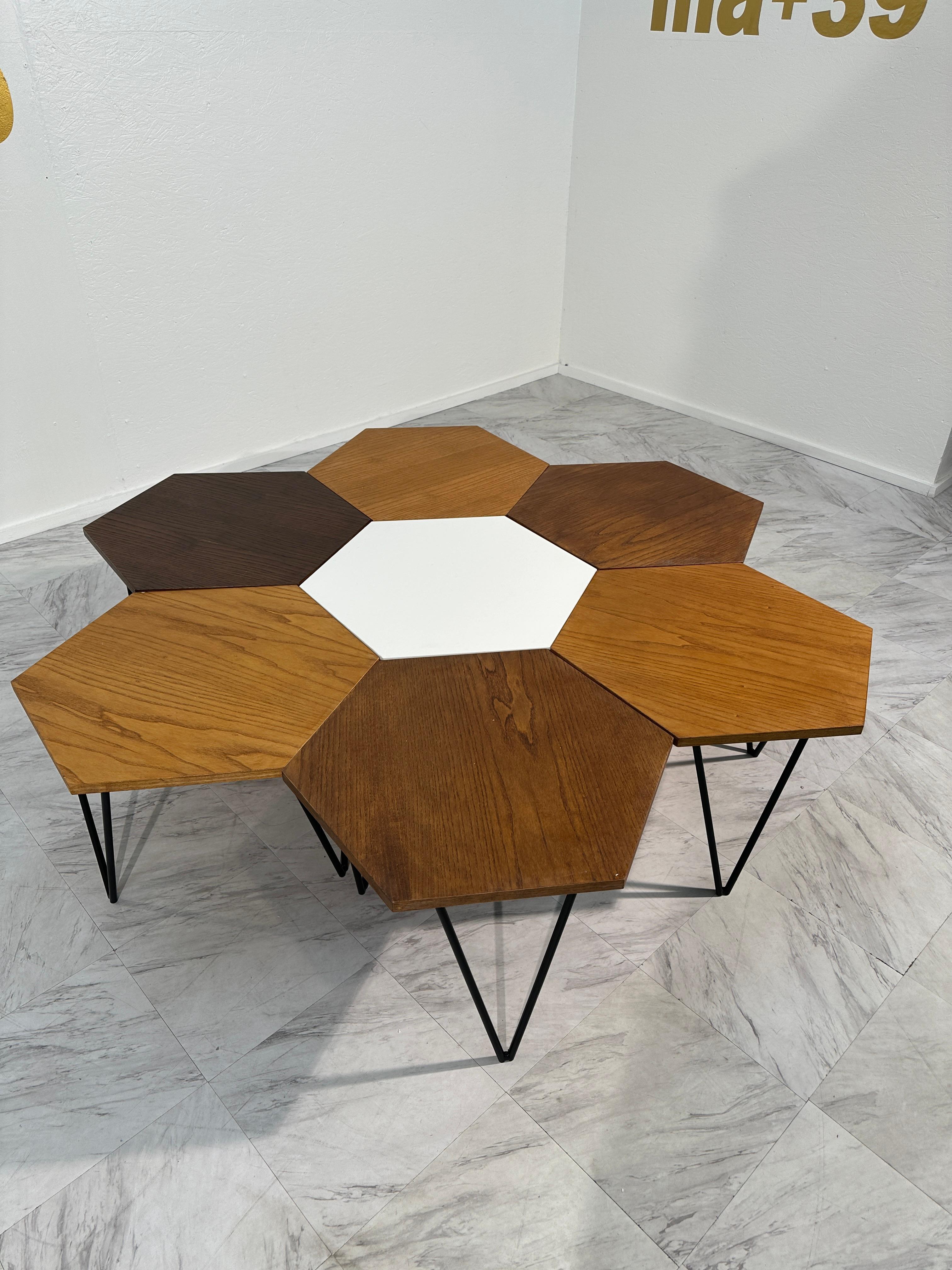 Immerse yourself in the epitome of mid-century Italian design with this exceptionally rare set of modular coffee tables by Gio Ponti, meticulously crafted by ISA Bergamo in the 1950s. Each piece bears the mark of authenticity with a metal