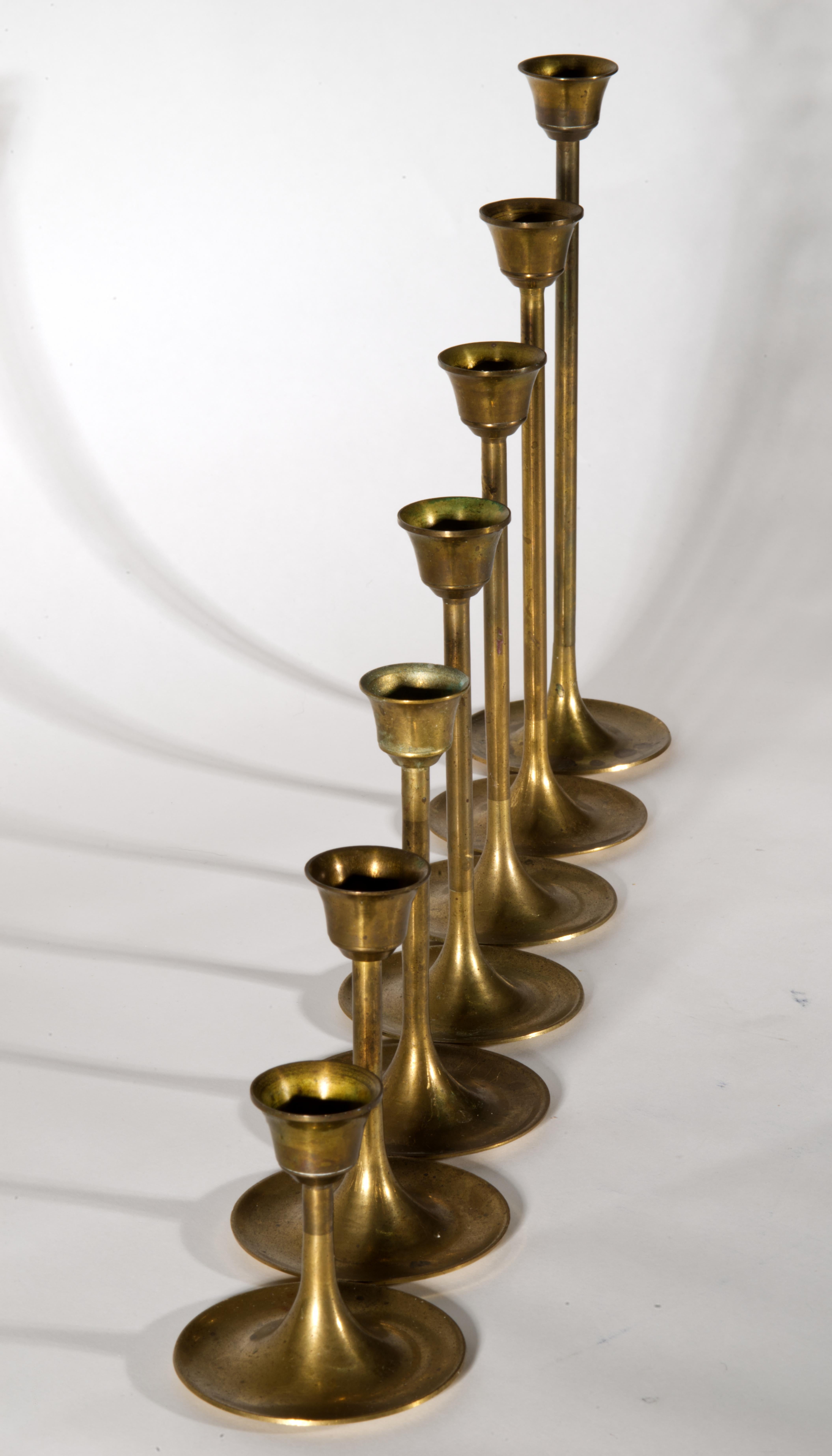 XX secolo Set of 7 Graduated Scandinavian Modern Brass Candle Holders in vendita