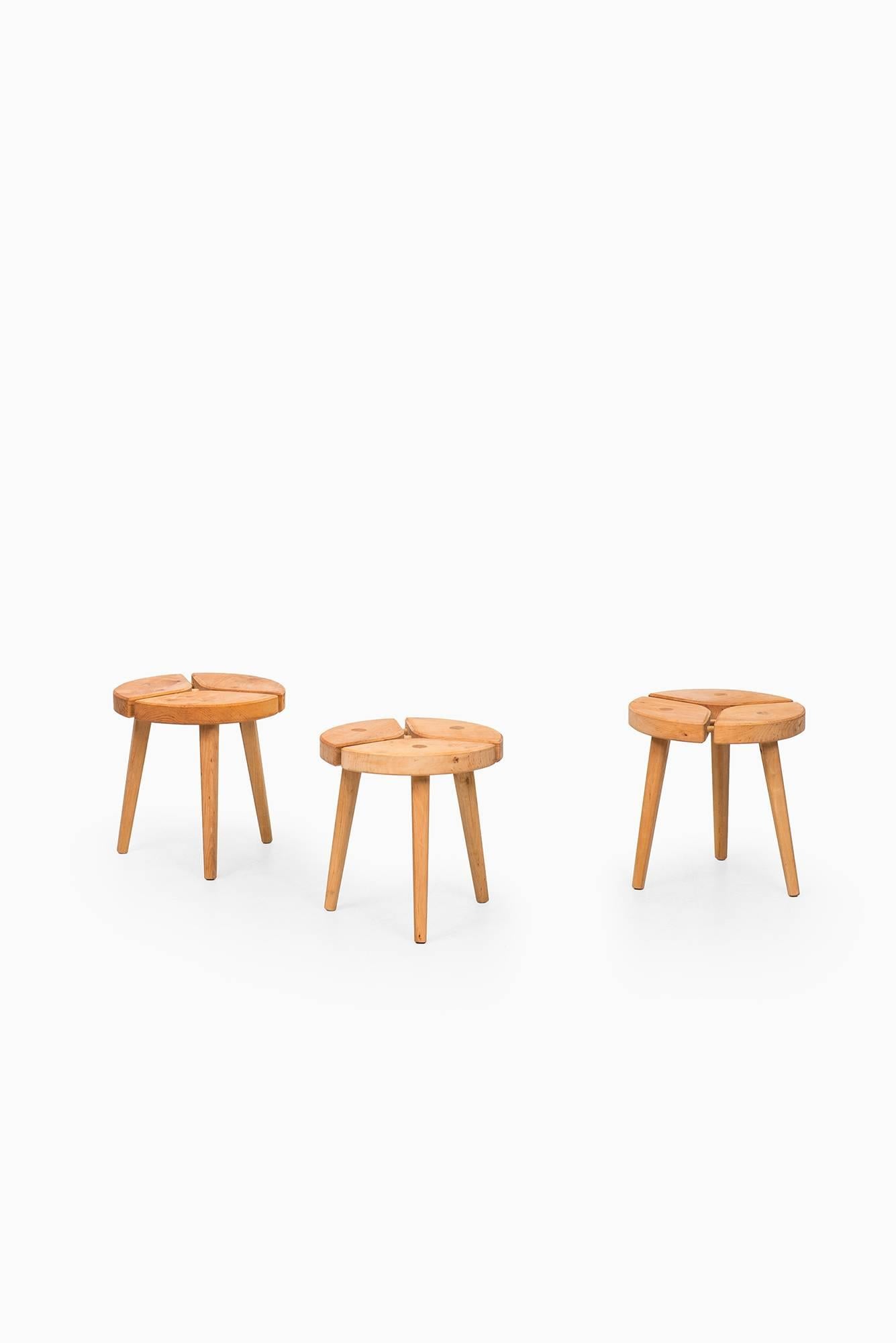 Set of seven low stools with beautiful details. Probably produced in Sweden.