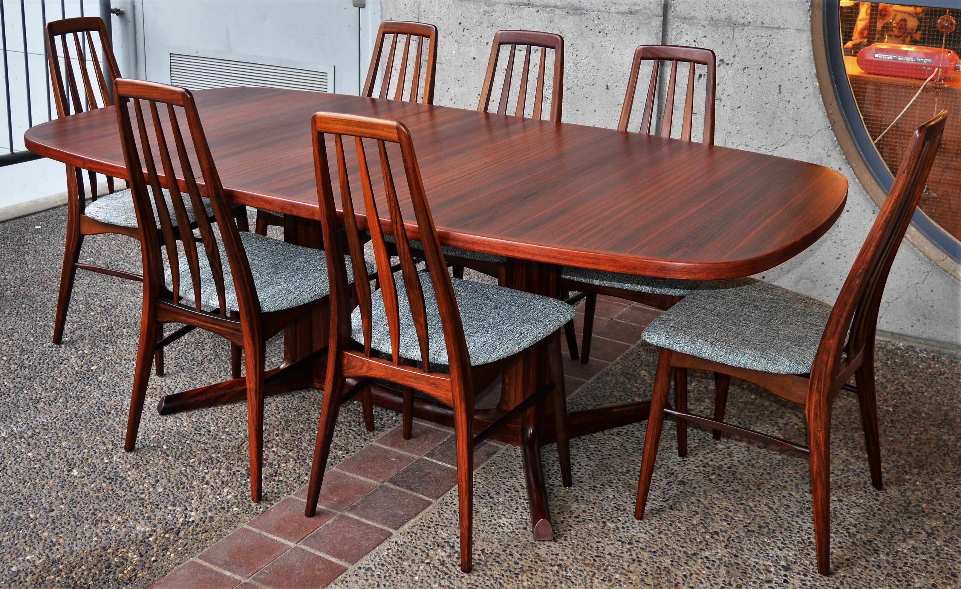 This gorgeous set of 7 Koefoeds Hornslet rosewood Eva chairs are known for their comfort, due to the ergonomic contoured lumbar support. Designed in the 1960s by Niels Koefoed and branded with the makers mark and the Danish Control logo underneath.