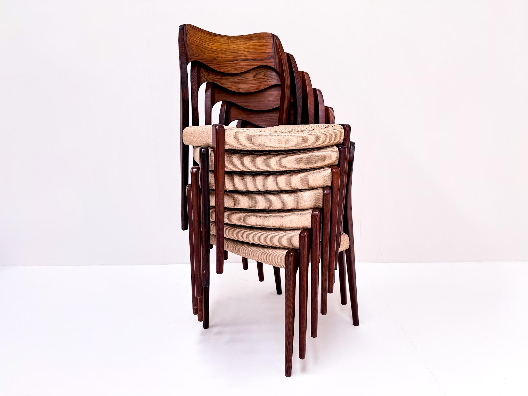 A stunning and rare complete set of 7 Model 71 dining chairs, designed by Niels Otto Møller in the 1960s and made in Denmark. Crafted from solid rosewood, these chairs showcase beautiful organic curves and exceptional Scandinavian craftsmanship.
The