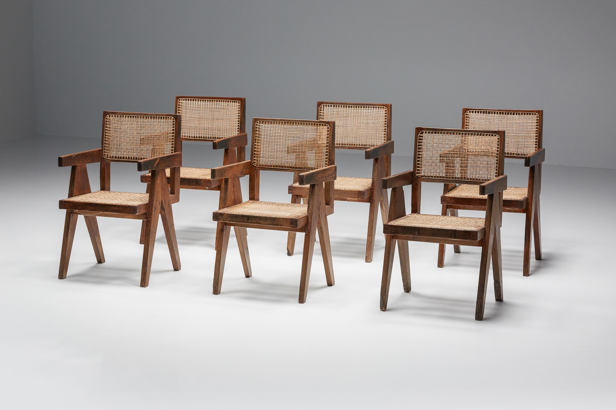 Pierre Jeanneret office/dining cane chair; Authentic Chandigarh Model PJ-SI-28-B. 
Offering a set of seven chairs, priced individually.

This chair is not only a fantastic piece, it’s a design icon. Finally, it’s the most famous item of all