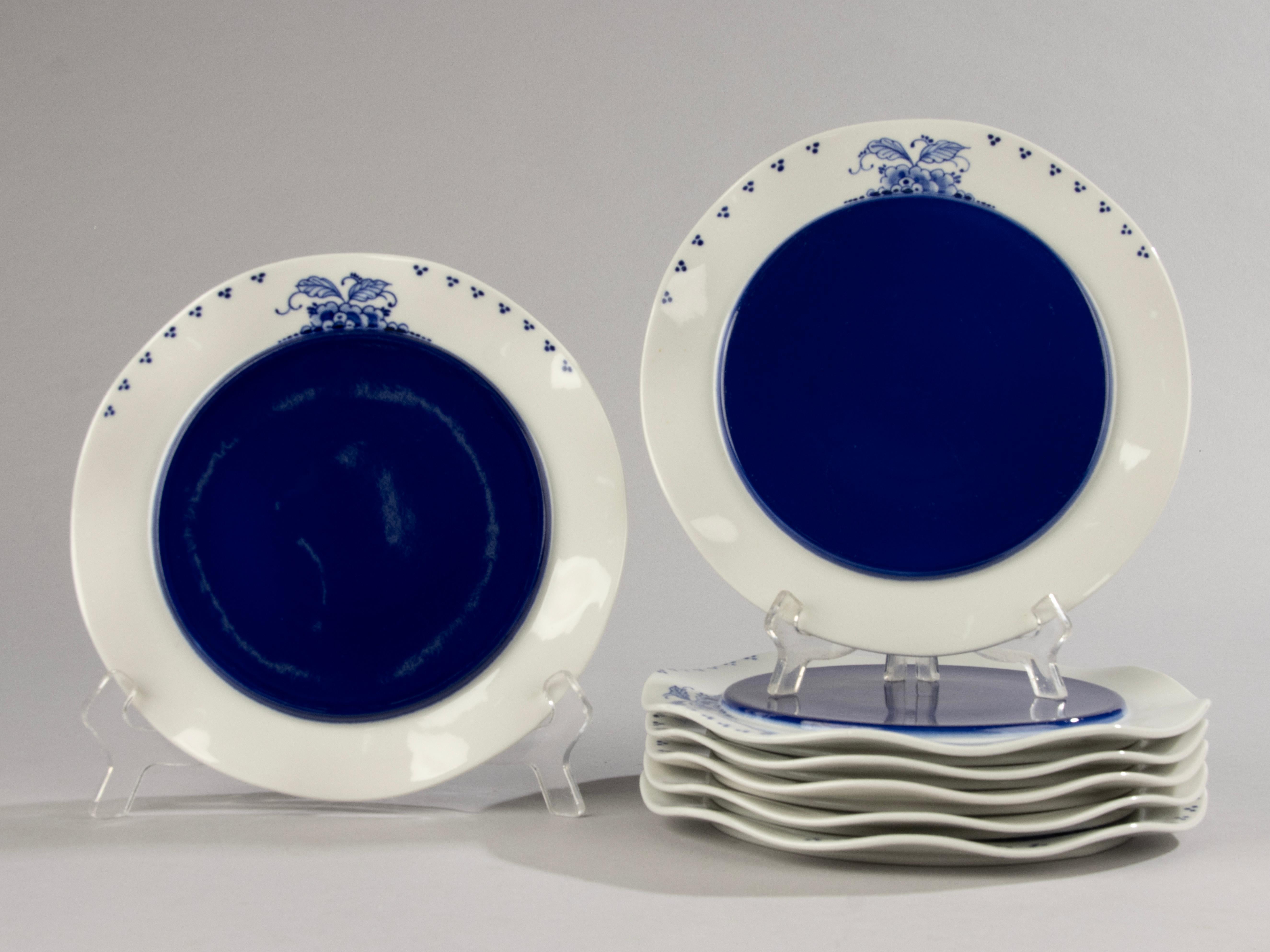 A beautiful set of 7 porcelain plates, made by the Dutch brand De Porceleyne Fles Delft. Designed by the famous Czech architect / designer Bořek Šípek.
The plates are beautifully designed, with a wavy edge and hand-painted decorations in a typical