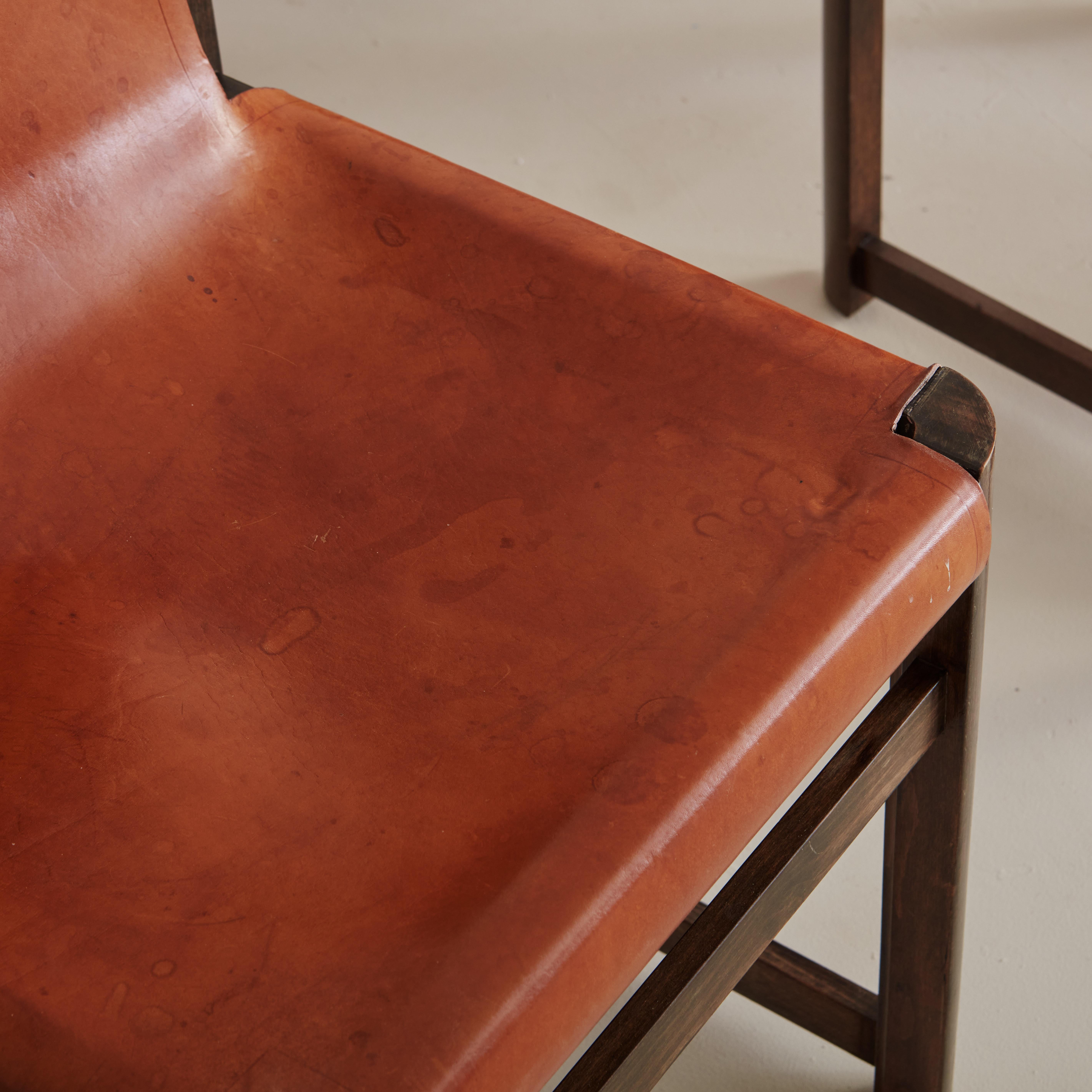 Spanish Set of 7 Saddle Leather Sling Back Dining Chairs by Jordi Vilanova